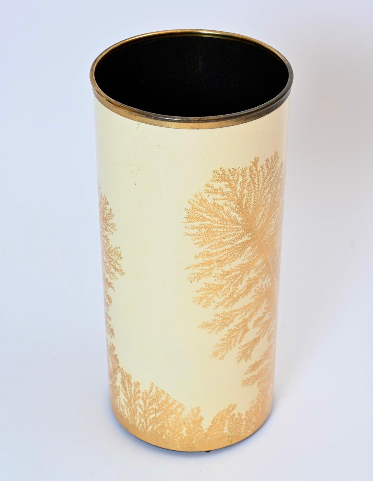 An exquisite circular umbrella stand with brass rim by Piero Fornasetti entitled ‘Alghe Marine’ or ‘Marine Algae’. First designed in the 1950s, this is a rare 1960s issue with gold leaf decorative transfers on a cream colored background. The