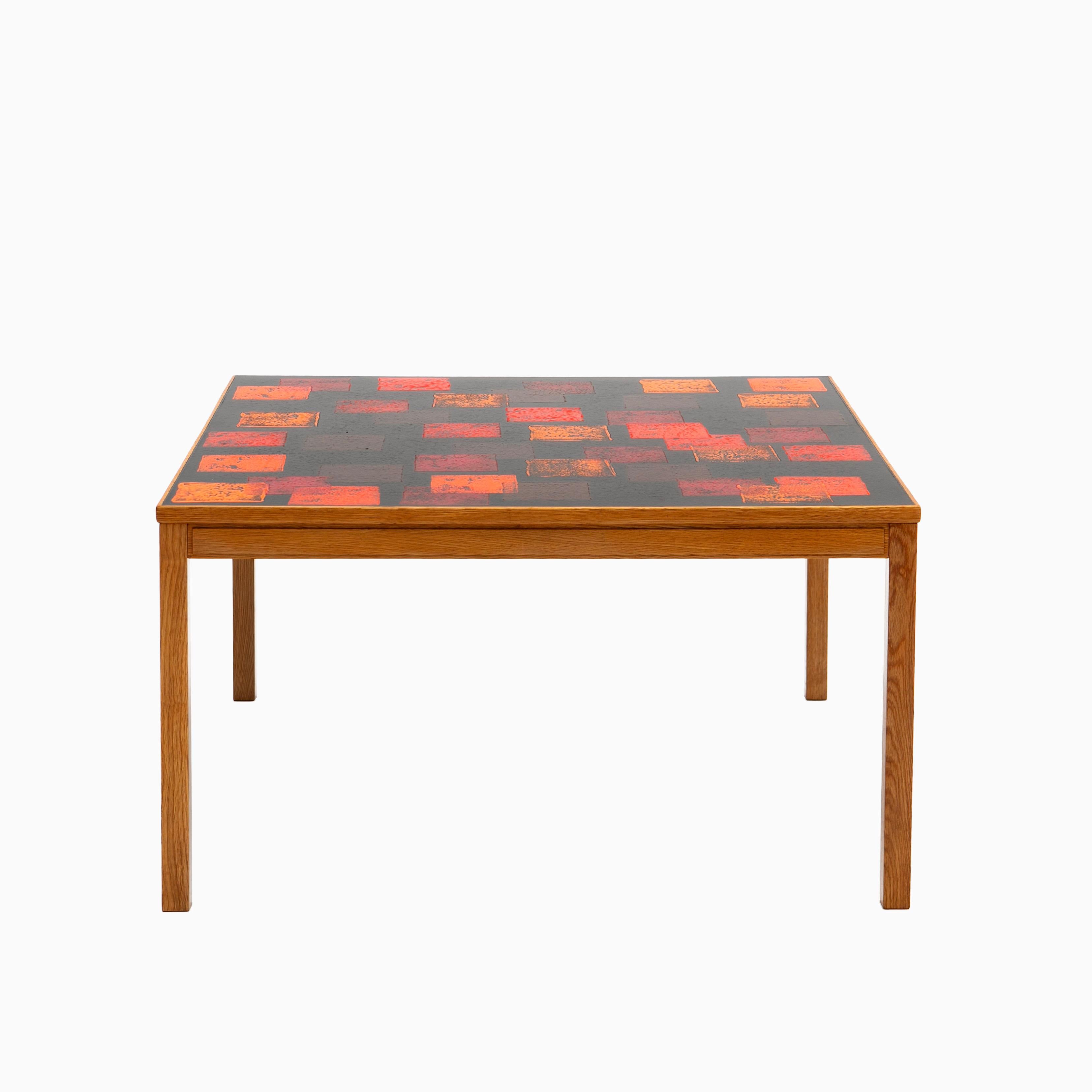 Algot P. Törneman 1909-1993
Enamel on copper and oak coffee table by for Nordiska Kompaniet.

This table was produced in a limited edition of 24 tables and this one is numbered 11.