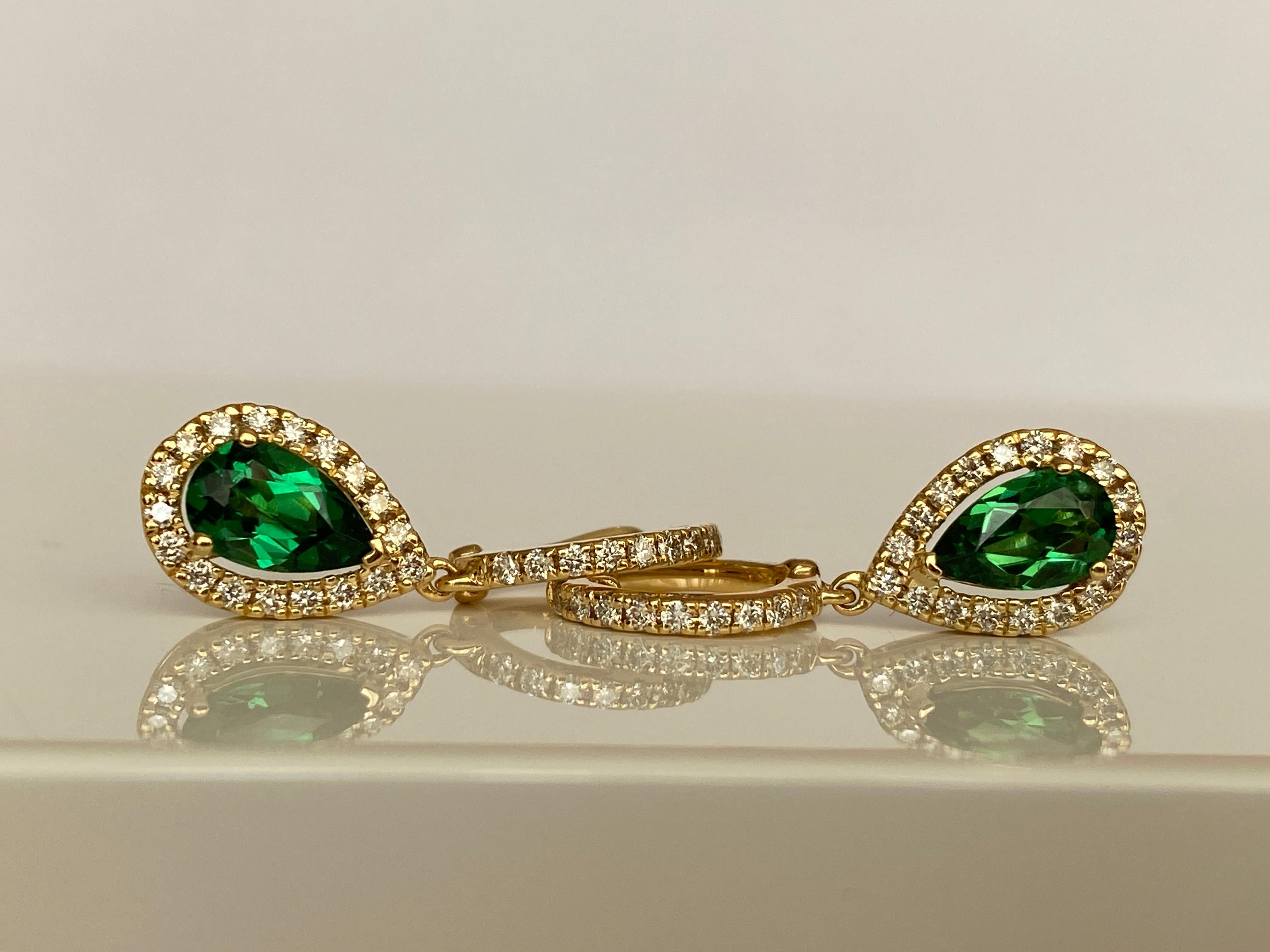 Illuminate your look with the extraordinary brilliance of these Vivid Green Tsavorite Drop Earrings, totaling 1.61 carats of rare, natural beauty. Each gemstone is a masterfully cut Tsavorite garnet, chosen for its intense, vibrant green hue — a