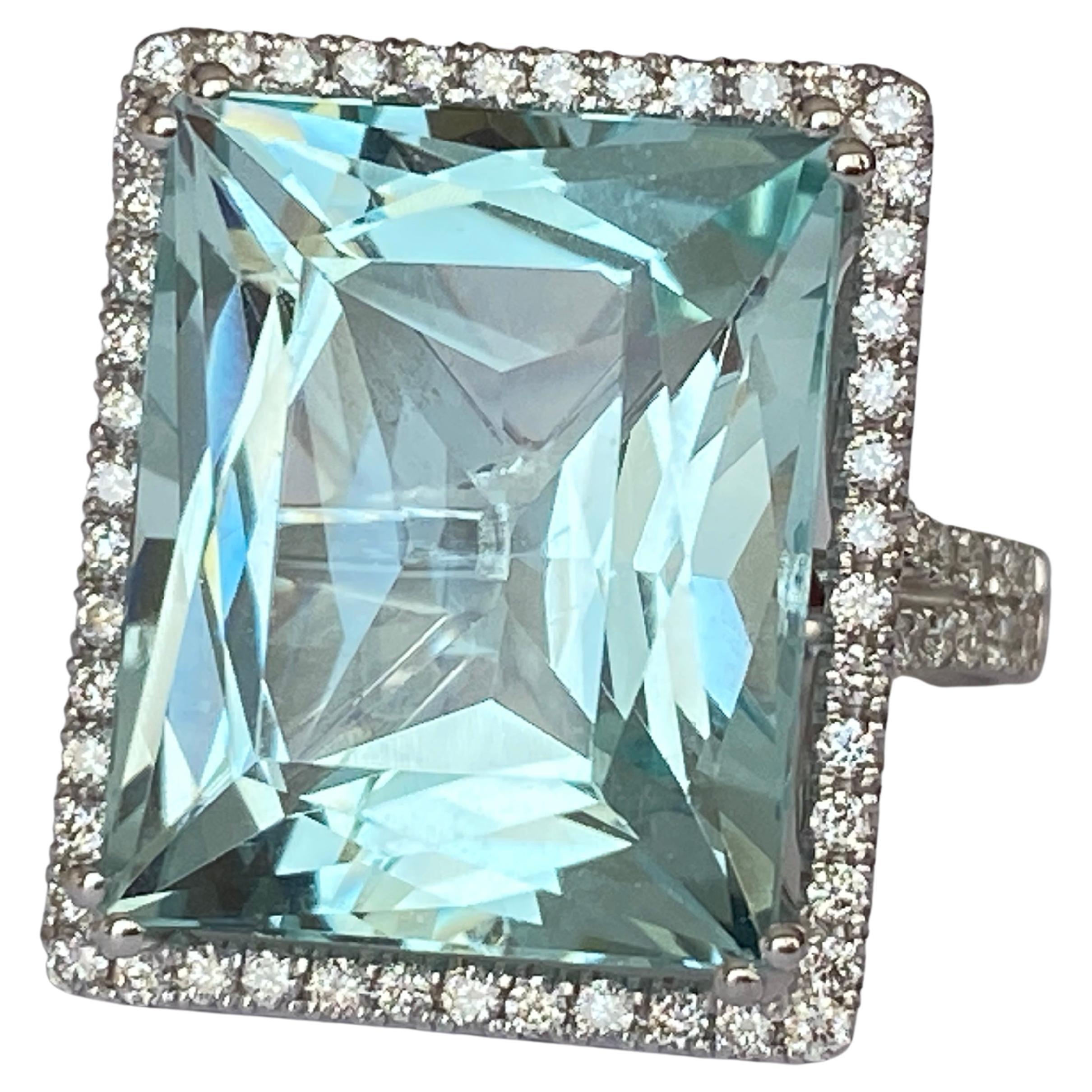 Exclusive handmade ring in 18 kt white gold set with rectangle cut aquamarine of approx. 18.00 carats! and decorated with 88 pieces of brilliant cut diamonds. Total diamonds: 1.00 ct E/F/G/VS/P1. Few stones are of Pique quality. ALGT certificate is