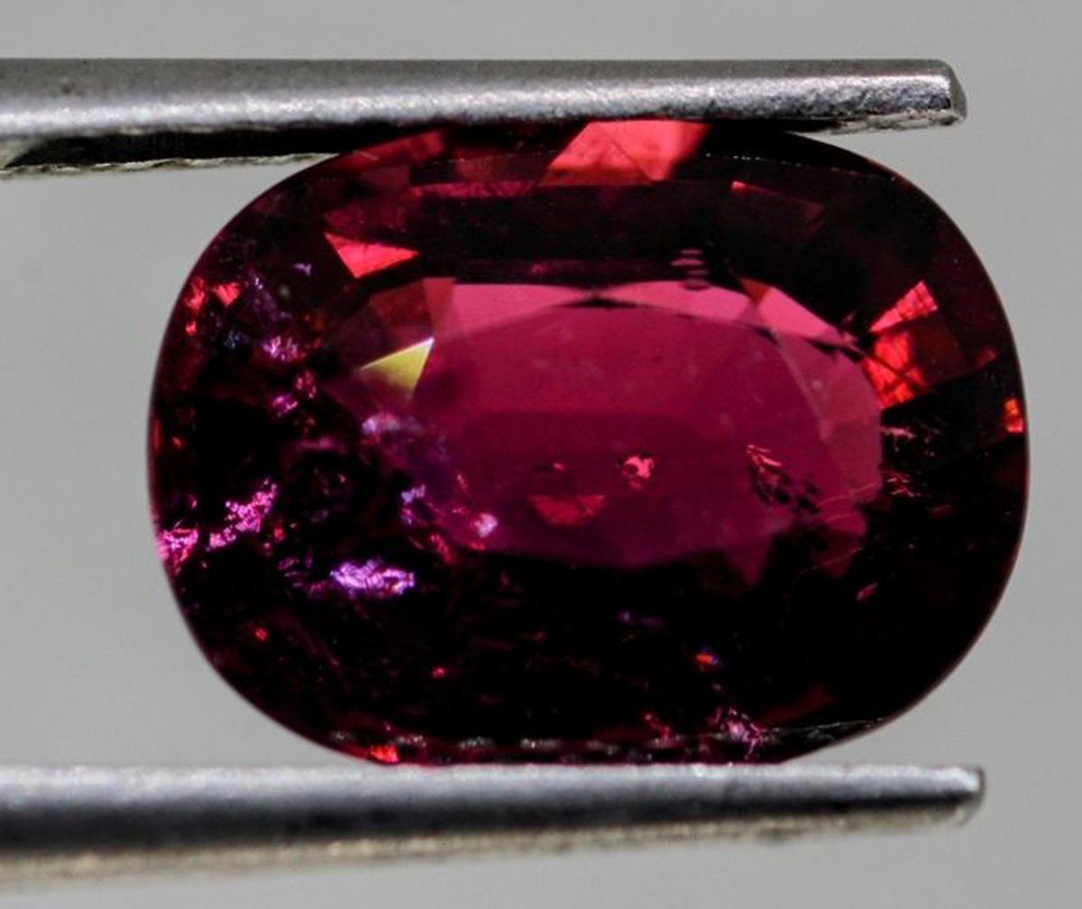 A unique and rare Natural Rubellite Gemstone. Weighing at 3.02 Carats.

This natural earth mined gemstone has a beautiful and captivating Deep Purplish Pink color with a vitreous appearance. Its mesmerizing array of dispersed inclusions, along with