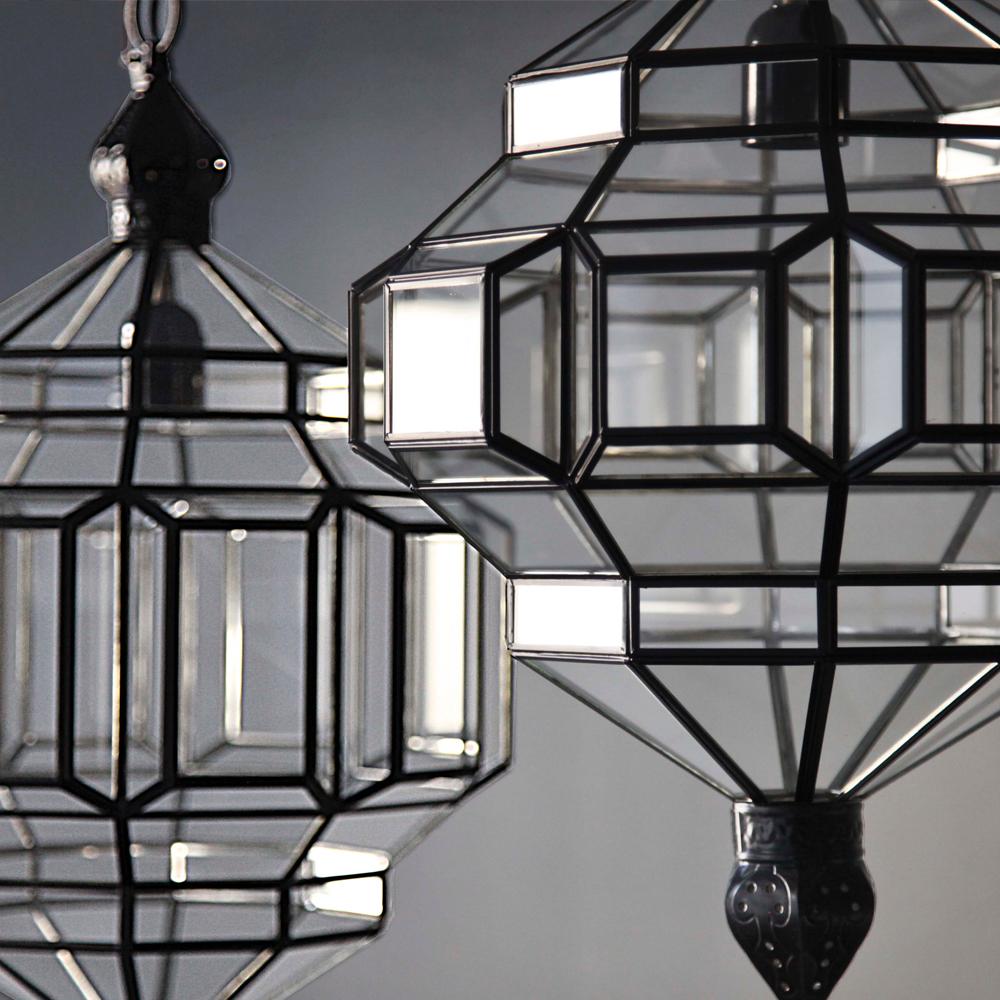 These glass lanterns are made in a generations-old workshop in Granada, Spain. Each pendant light is hand forged, and reflects the influence of Moorish design that can be observed throughout the region.

These lanterns, with their multitude of