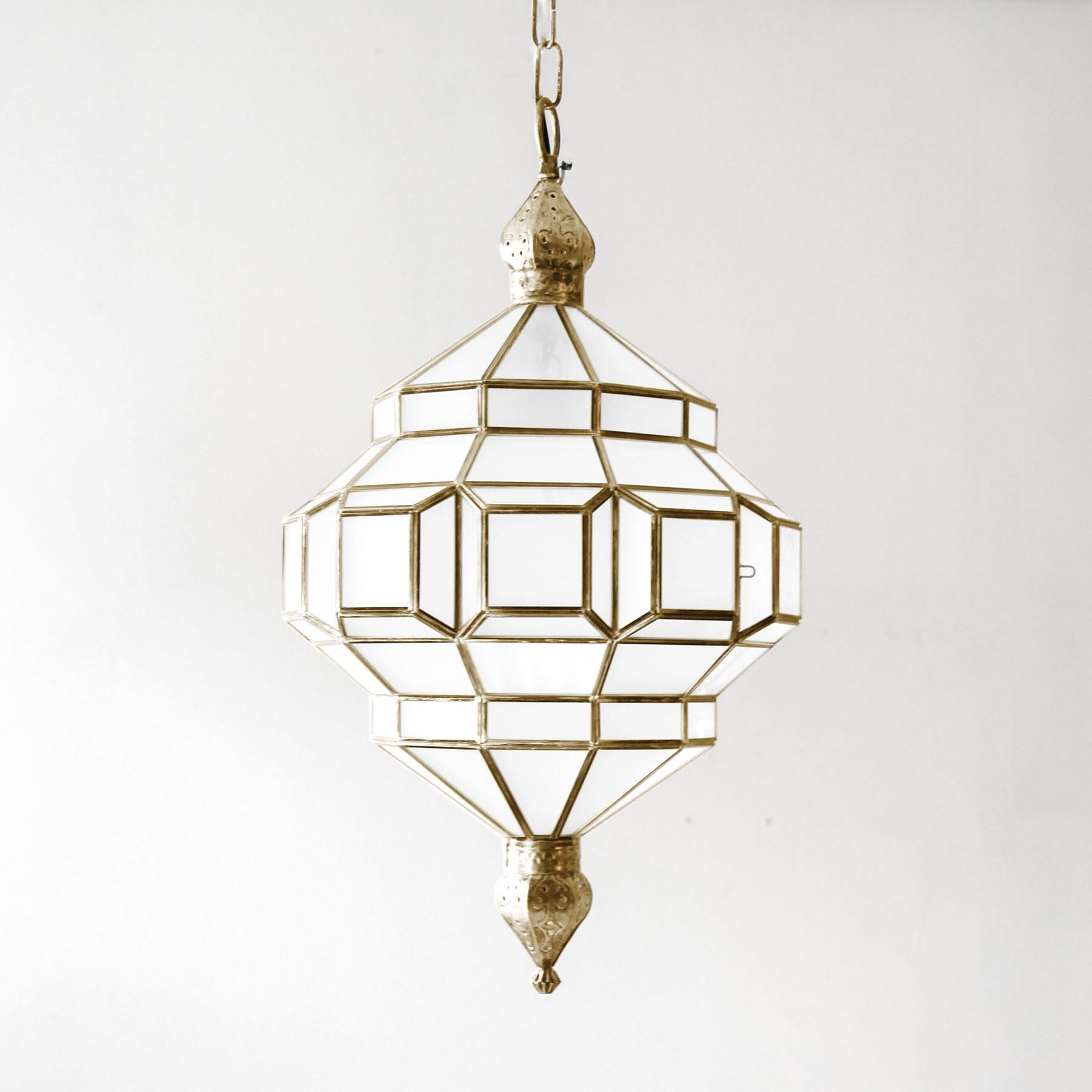 These glass lanterns are made in a generations-old workshop in Granada, Spain. Each pendant light is hand forged, and reflects the influence of Moorish design that can be observed throughout the region.

These lanterns, with their multitude of