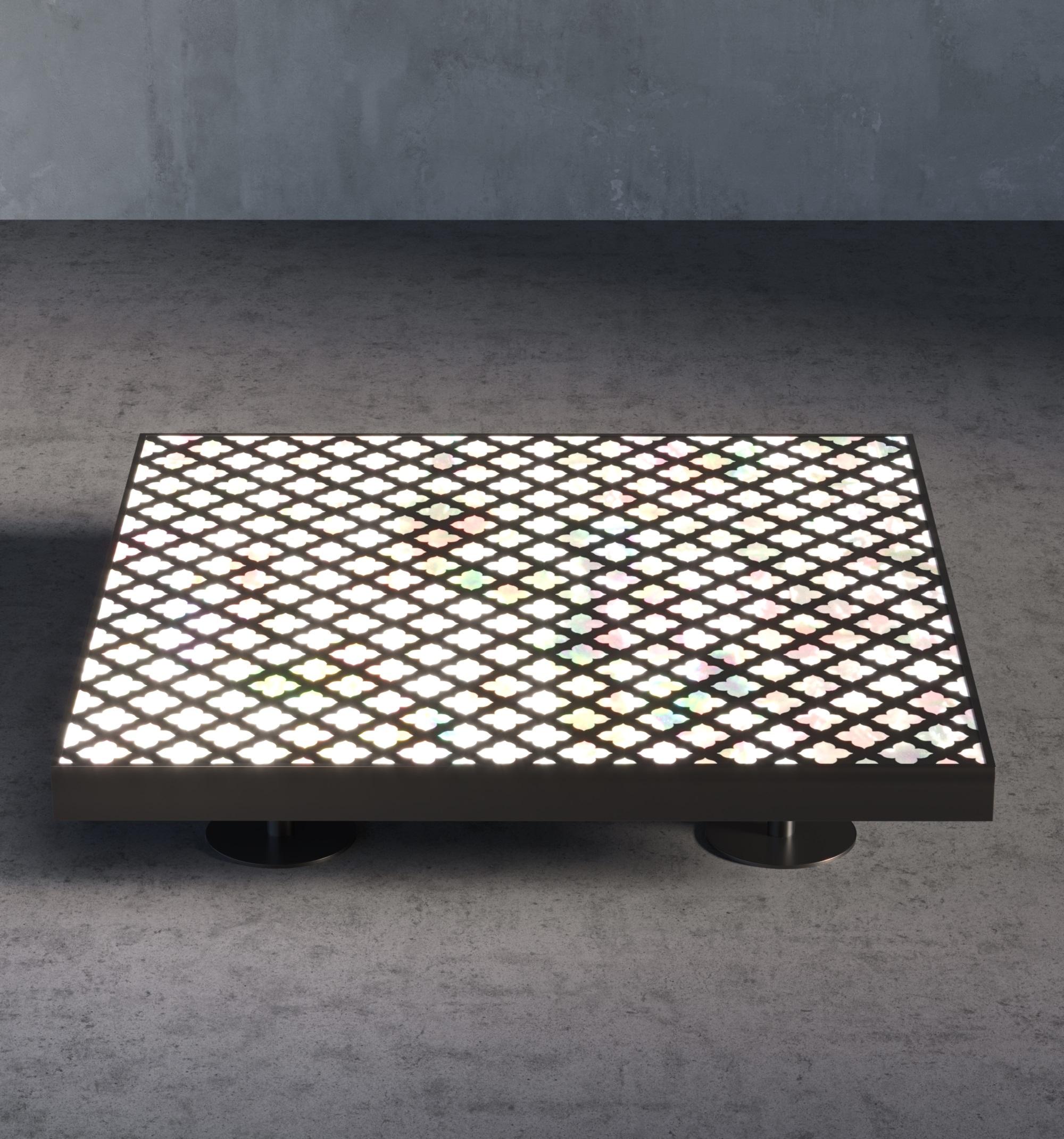 Alhambra Center Table features mother of pearl furniture where small pieces of the shell are cut into delicate shapes and arranged in intricate patterns. 

The Alhambra Center Table can be replaced with other stone options including tiger eye, Lapis