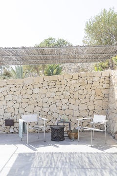 Sillón Alias 109 Spaghetti con asiento de PVC beige y estructura de acero cromado