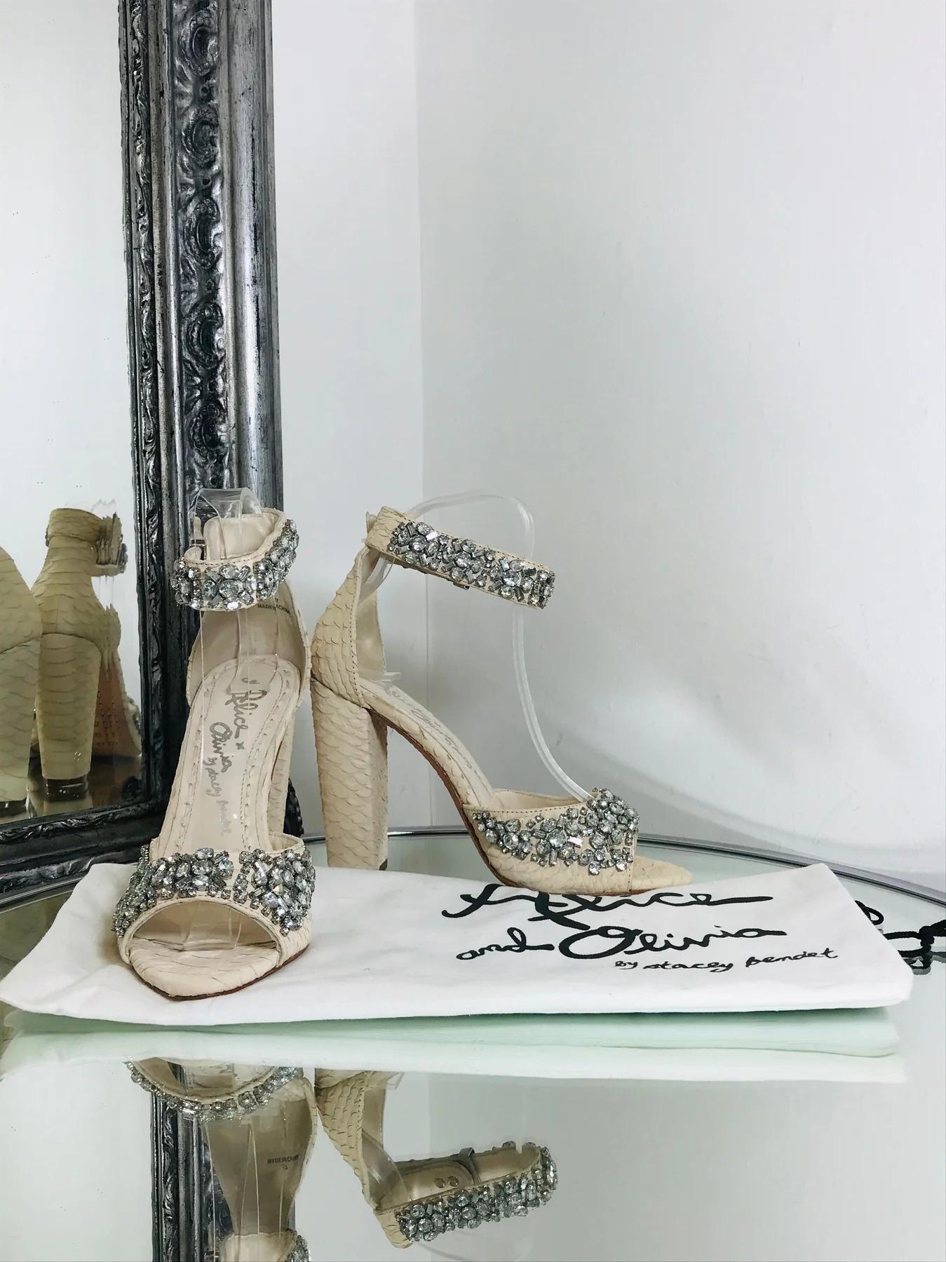 Beautiful Sandals by Alice and Olivia and Stacy Benet

Light beige in colour. Embellished crystal stud accents. Snake embossed leather. Buckle strap with push pin closure. Heel measures approx 11 cm.

Additional information:
Size – 37
Condition –