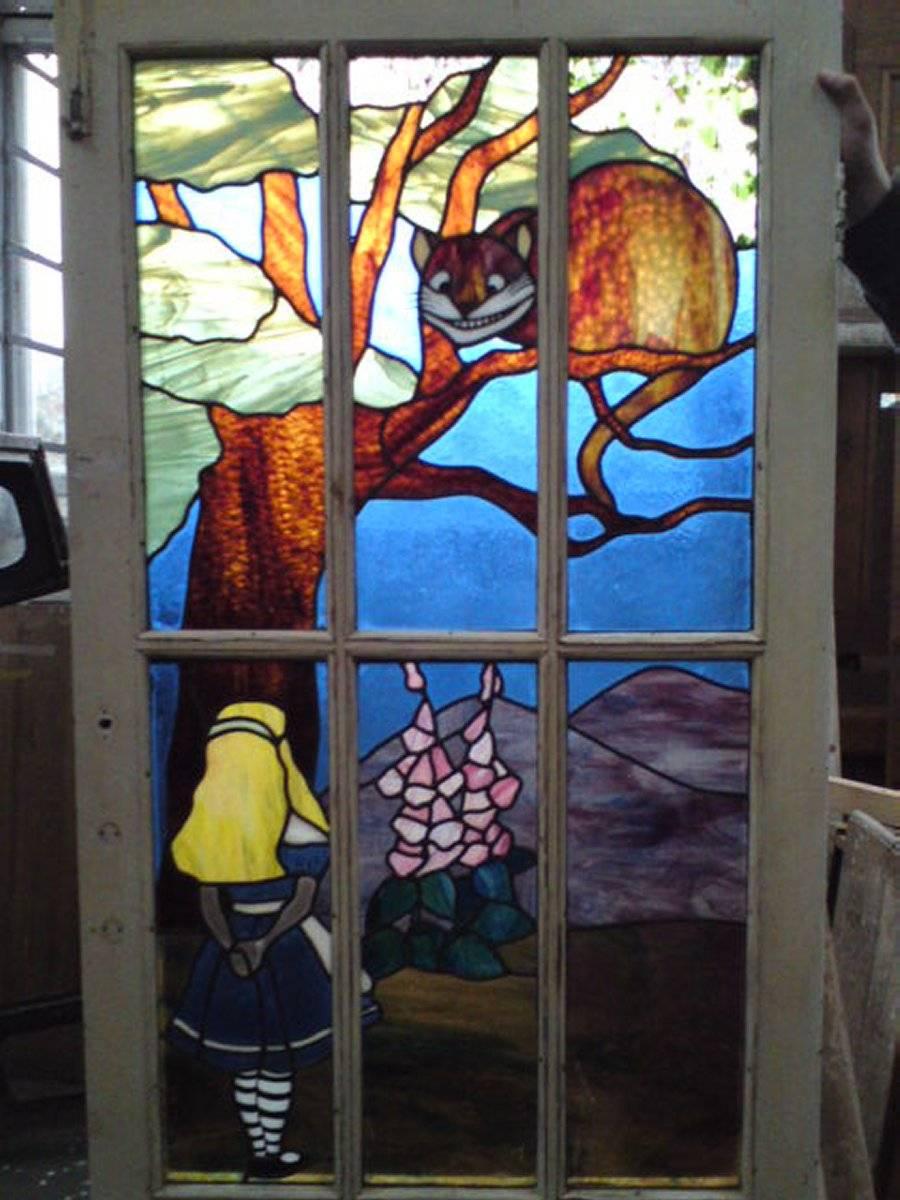 Alice in Wonderland incredible suite of stained and leaded glass set in the original doors and windows,.
Please note this suite is in two listings and the price here is for the five pieces in both listings.
A one-off commission was removed from a