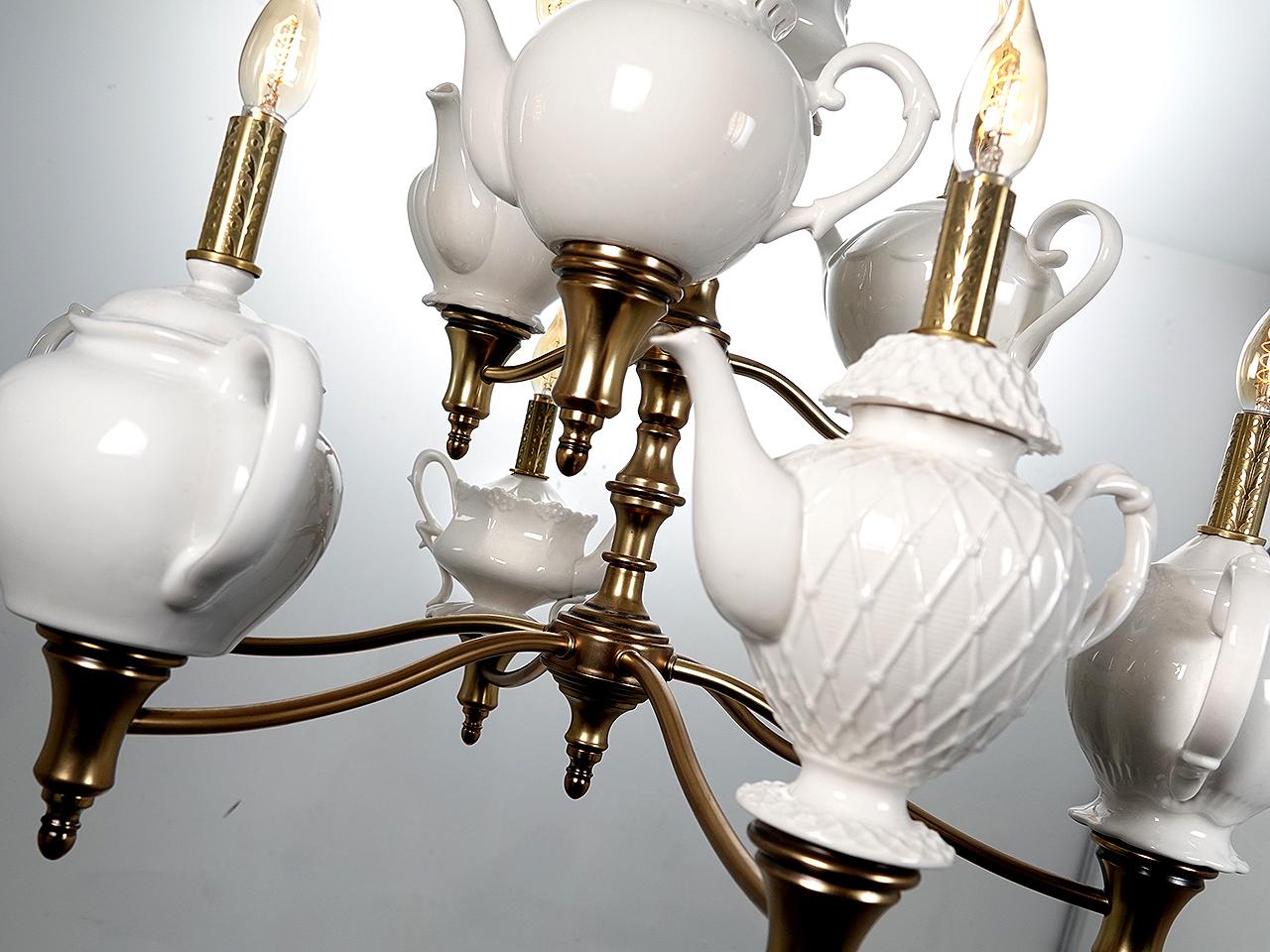 This is not the type of lighting you will normally find in my listing. I just couldn't help myself. The fixture has great style and a sense of humor. The lamp features a collection of ten different tea pots and nine have bulbs on top. Every time I