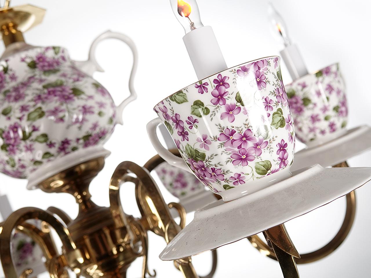 This is not the type of lighting you will normally find in my listing. I just couldn't help myself. The fixture has great style and a sense of humor. The lamp features a collection of six cups and saucers surrounding a matching tea pot. Every time I