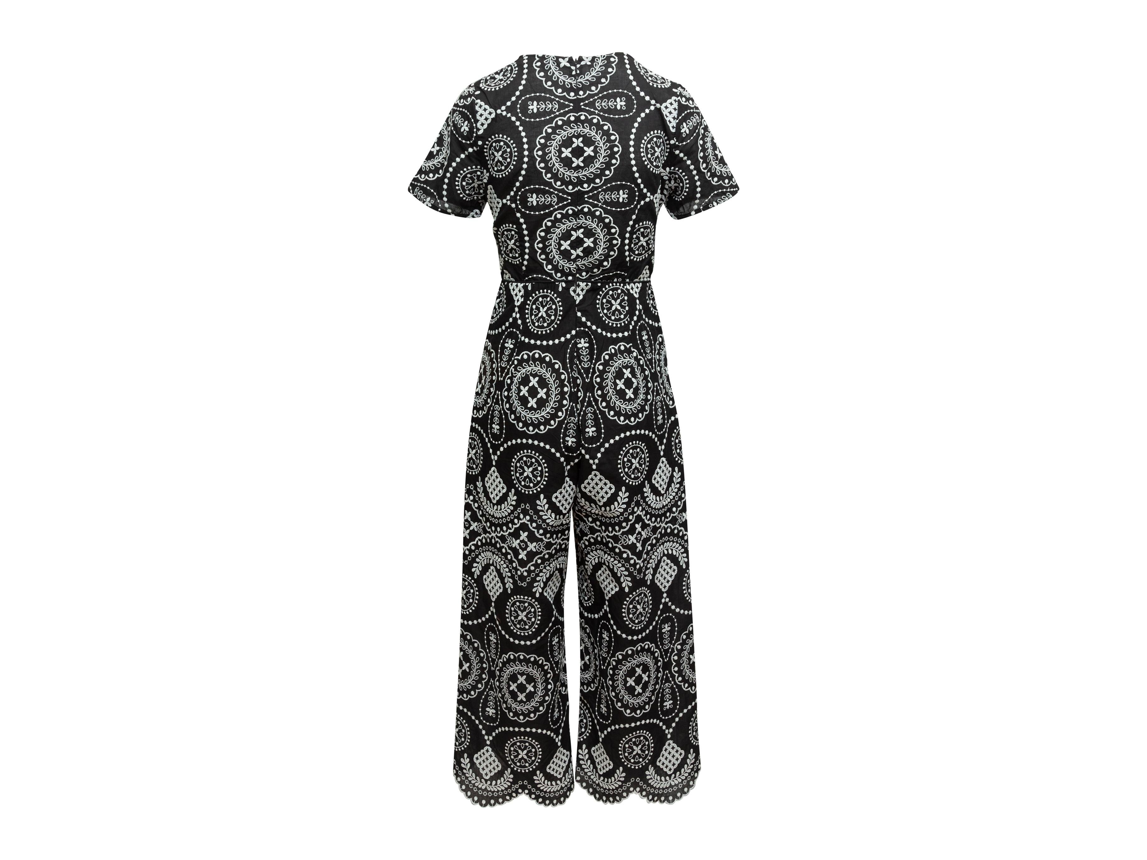 Product details: Black and white jumpsuit by Alice McCall. Embroidery throughout. Crew neck. Short sleeves. Zip closure at back. Designer size 8. 28