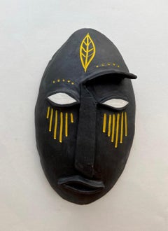 Mask 11, abstract black and yellow clay mask by Alice Mizrachi