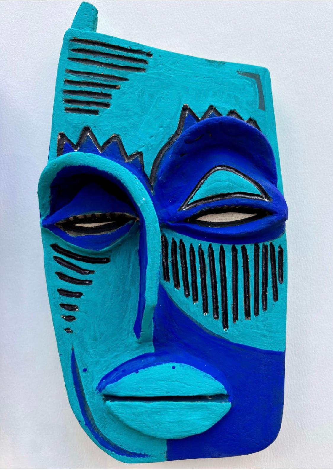 Clay mask with a face outline painted in light and dark blue tones with black outlines. 

Unique one of a kind painting signed by the artist. 

ARTIST BIO 
Alice Mizrachi is a New York based interdisciplinary artist and educator working in the
