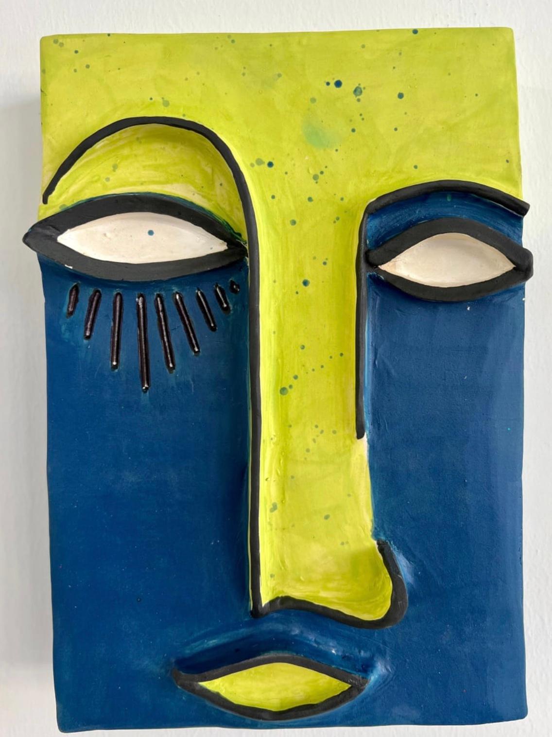 Clay mask with a face outline painted in lime green and dark blue with black lines. 

Unique one of a kind painting signed by the artist. 

ARTIST BIO 
Alice Mizrachi is a New York based interdisciplinary artist and educator working in the mediums