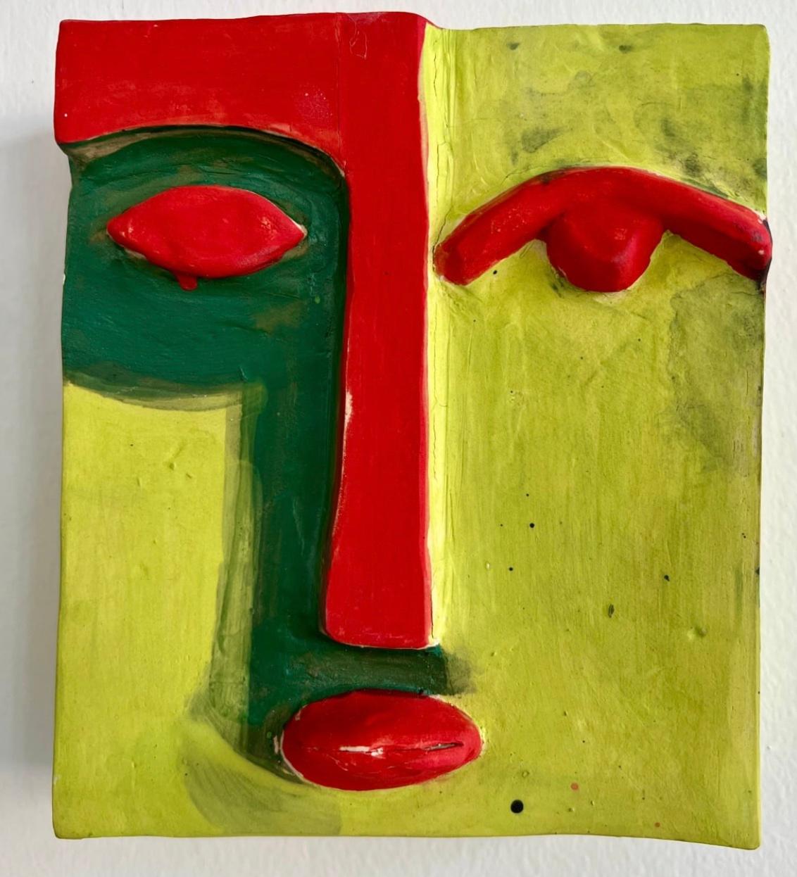 Clay mask with a face outline painted in yellow, green and red. 

Unique one of a kind painting signed by the artist. 

ARTIST BIO 
Alice Mizrachi is a New York based interdisciplinary artist and educator working in the mediums of painting, murals