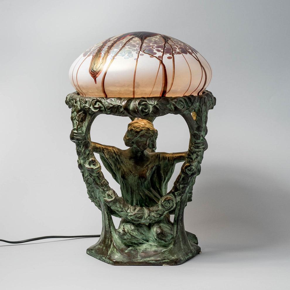 A beautiful and rare table lamp in solid bronze and with glass shade, designed and signed Alice Nordin. For Herman Bergman, Sweden early 1900s.

Wiring needs to be replaced.