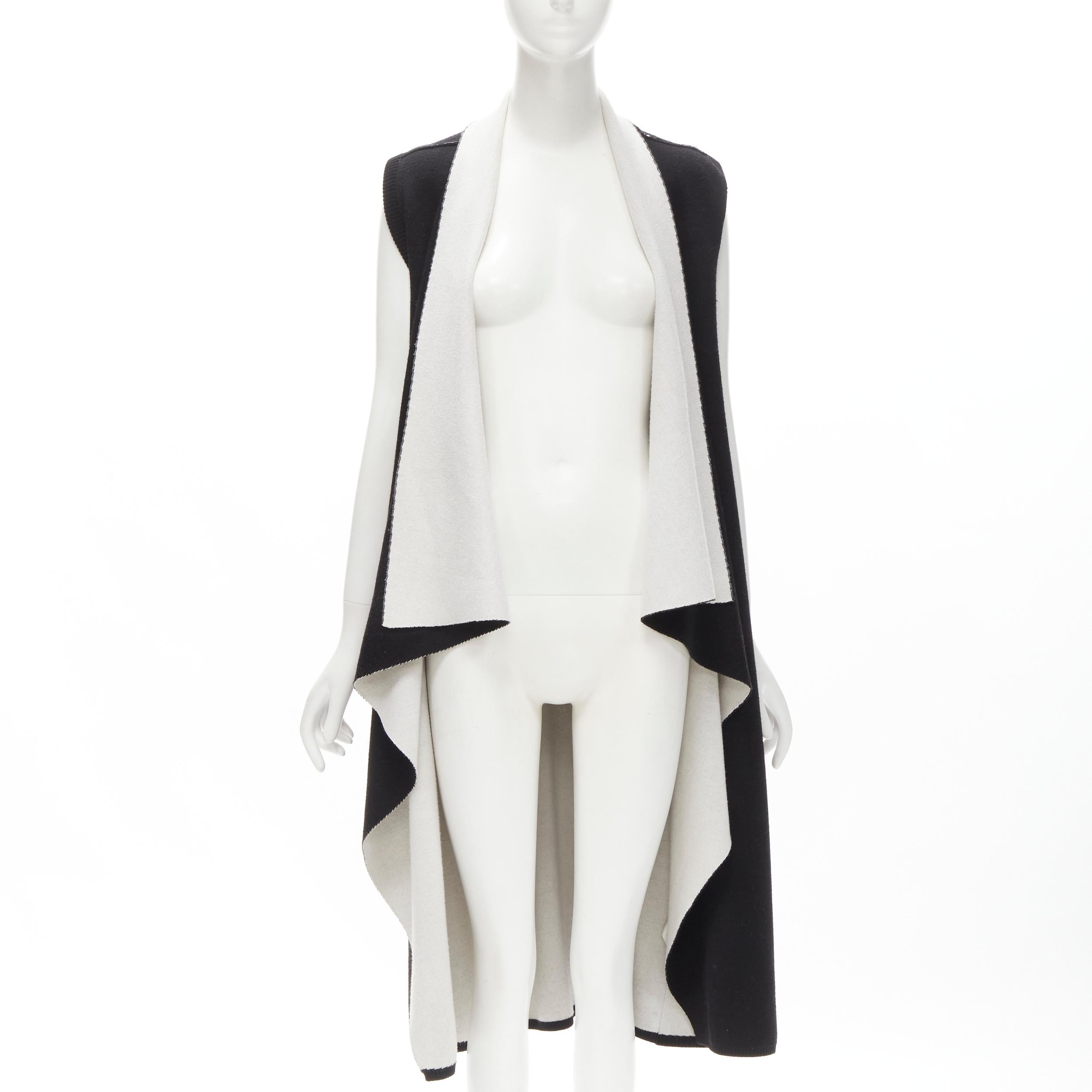 ALICE OLIVIA 100% wool black grey waterfall draped collar long vest XS
Brand: Alice Olivia
Material: Wool
Color: Black
Pattern: Solid
Made in: China

CONDITION:
Condition: Excellent, this item was pre-owned and is in excellent condition.