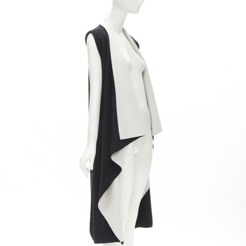ALICE OLIVIA 100% wool black grey waterfall draped collar long vest XS
Reference: KNLM/A00100
Brand: Alice Olivia
Material: Wool
Color: Black, Grey
Pattern: Solid
Made in: China

CONDITION:
Condition: Excellent, this item was pre-owned and is in
