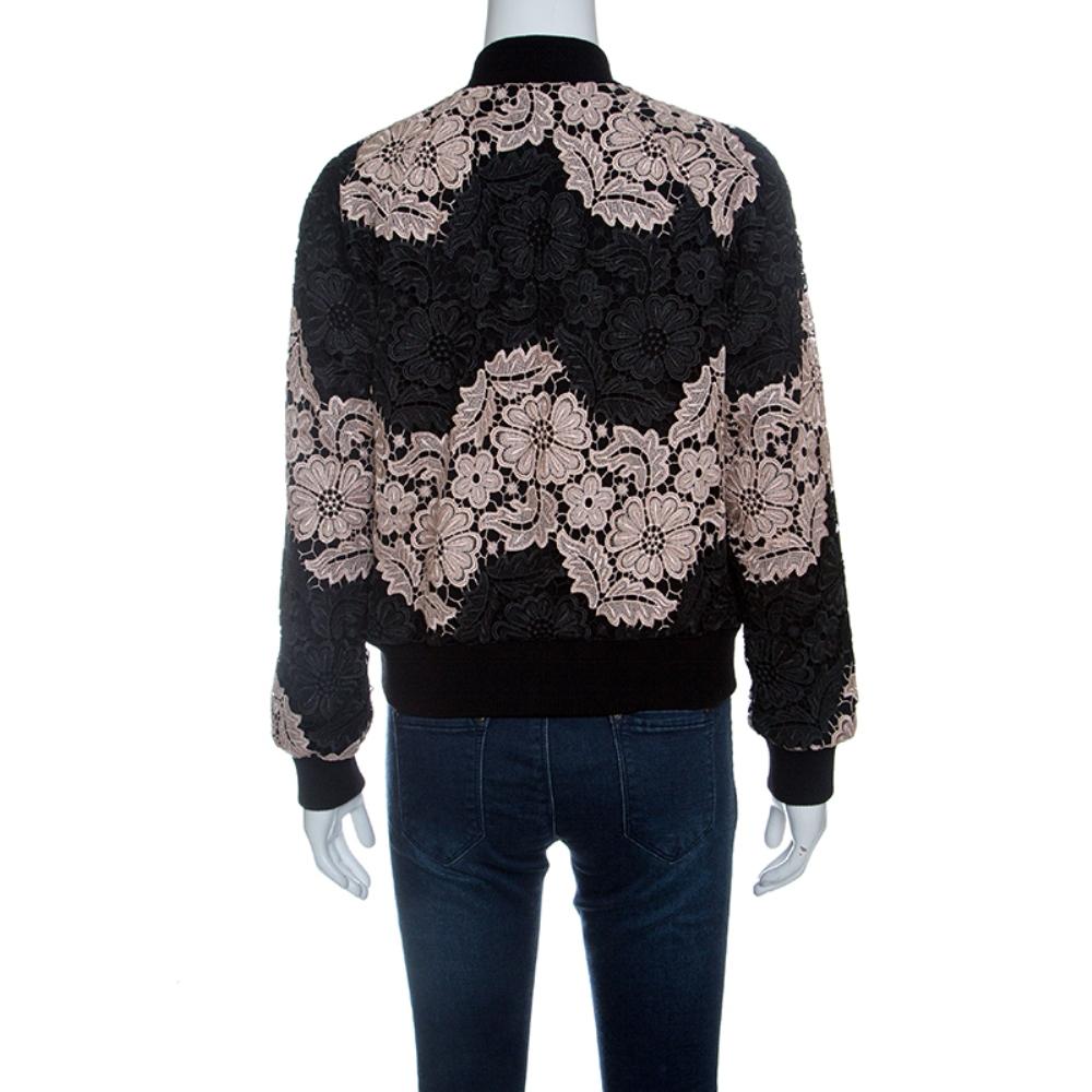 This winter beat the chills with some sass with this bomber jacket from the house of Alice+Olivia. Crafted into a dual-tone floral lace overlay design, this bomber jacket can be layered over your tops or paired with your denims during the day to set