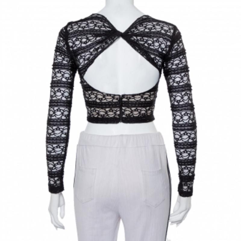 Go for stylish comfort with this lace top from Alice + Olivia. This elegant Rilo crop top can be easily teamed with skirts, pants, or shorts. It has a round neckline, full sleeves, and the back has a twist detail, zip closure, and cut-out detailing.