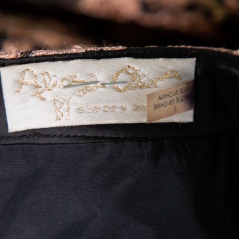 Go for this enchanting Alice + Olivia skirt if you like your style to stand out in a world full of basics. This feminine brown-hued skirt carries a floral jacquard pattern design all over, pleat detailing and is cut to a pretty maxi length.