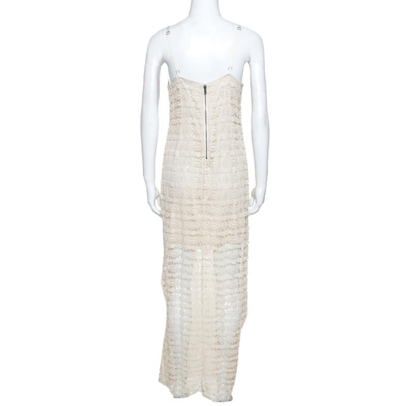 This lovely dress by Alice + Olivia is a must-have. Perfect for summer, this crochet dress comes on a stunning shade of cream. It features a simple silhouette with two straps, zip closure and luxurious lining. Pair it with some flats and dangling