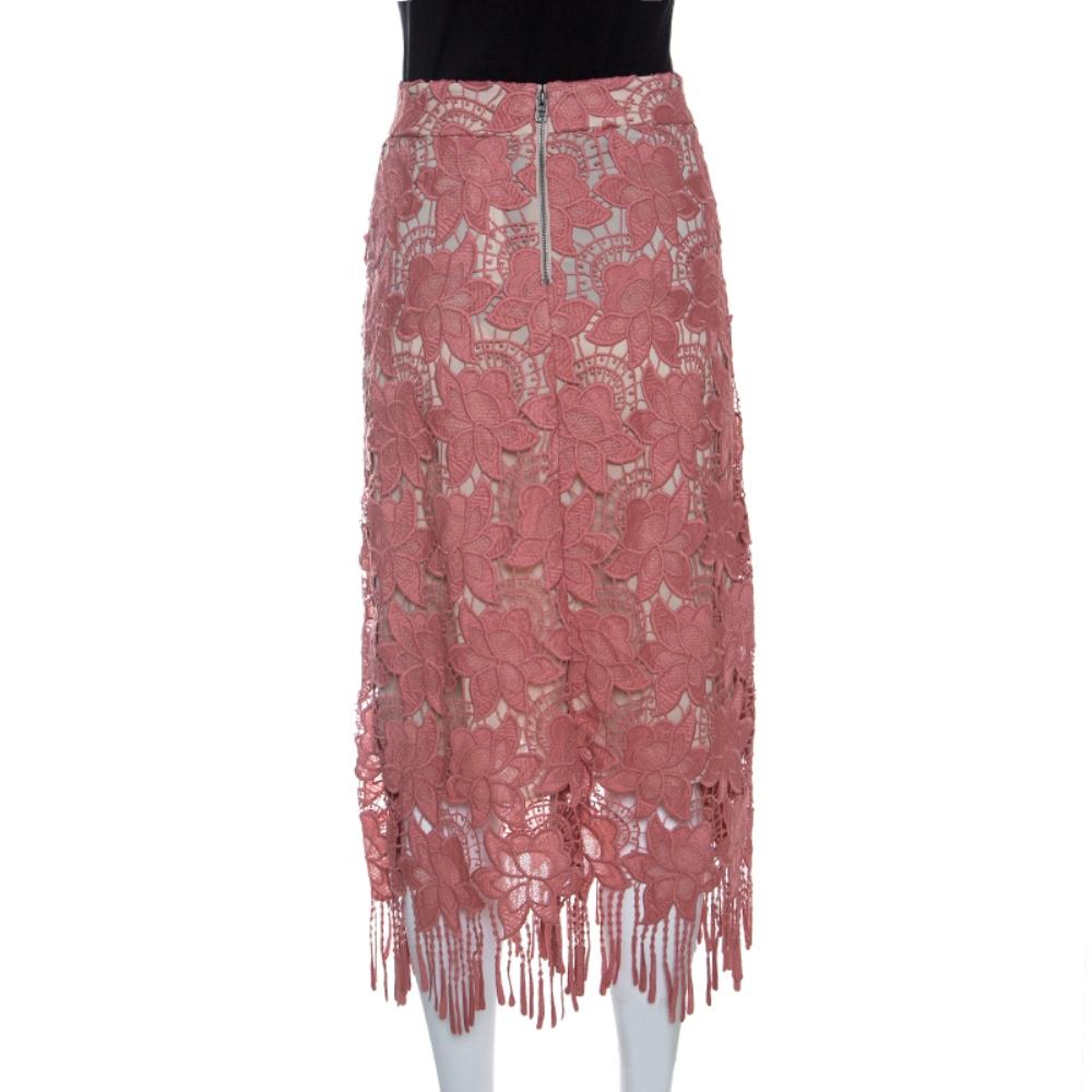 The house of Alice+Olivia makes sure you look like the fashion diva that you are with this stylish pencil skirt. Featuring a chic floral lace overlay detail that is enhanced by a tassel trimmed hem, this skirt can be flaunted for a classy evening