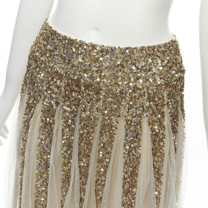 ALICE OLIVIA gold bling sequins sheer nude panel midi skirt US0 XS
Reference: AAWC/A00320
Brand: Alice Olivia
Material: Nylon
Color: Gold, Nude
Pattern: Solid
Closure: Zip
Lining:  Fabric
Extra Details: Zip closure at right side.
Made in:
