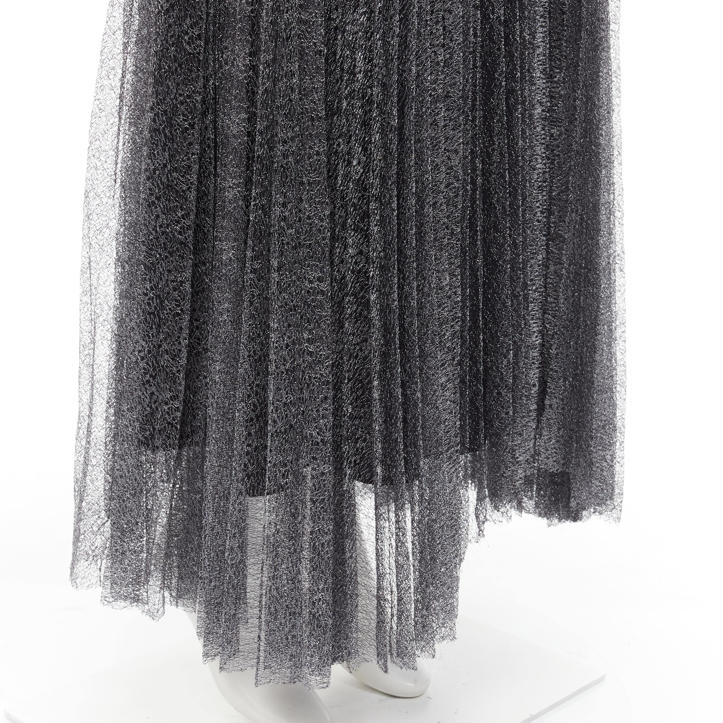 ALICE OLIVIA metallic silver thread black pleated asymmetric hem skirt US2
Brand: Alice Olivia
Material: Nylon
Color: Silver
Pattern: Solid
Closure: Zip
Made in: China

CONDITION:
Condition: Excellent, this item was pre-owned and is in excellent