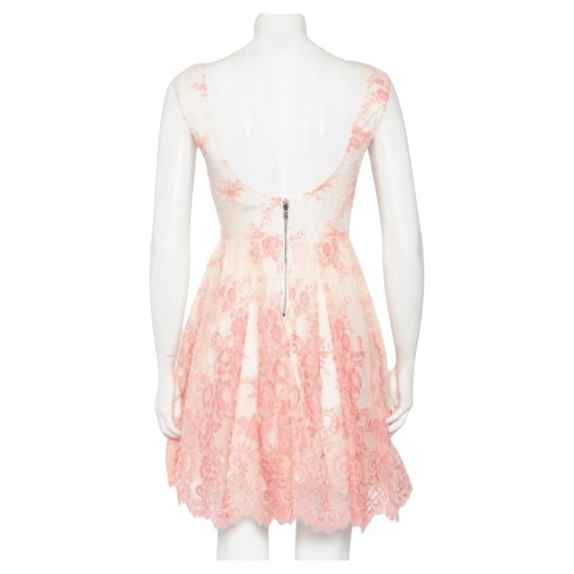 This Alice + Olivia dress brings elegant details and a chic silhouette. It is designed with a floral lace overlay, a nipped-in waist, and a scoop back with zip closure. It is made from the finest materials and bound to give you comfort.

