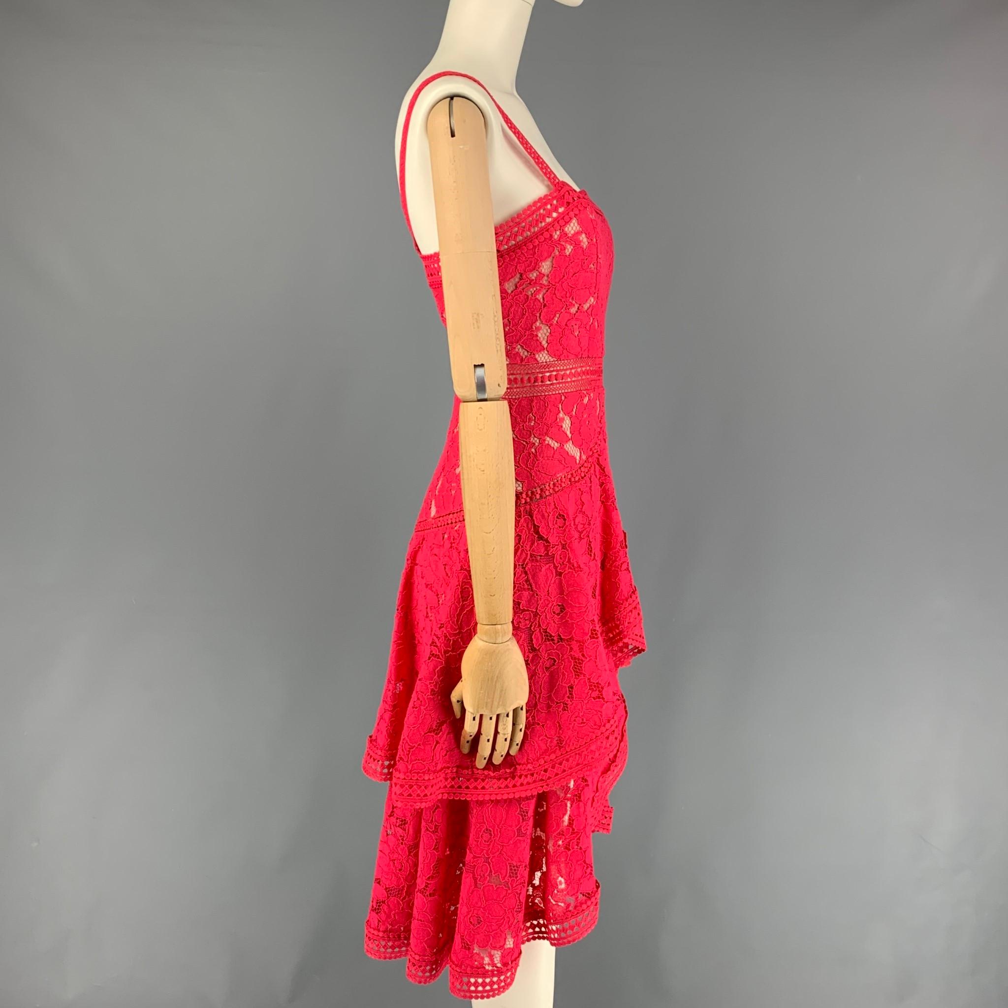 ALICE + OLIVIA dress comes in a raspberry eyelet cotton / nylon with a slip line featuring an a-line style and a back zip up closure. 

Very Good Pre-Owned Condition. Fabric tag removed.
Marked: 0

Measurements:

Bust: 28 in.
Waist: 26 in.
Hip: 34