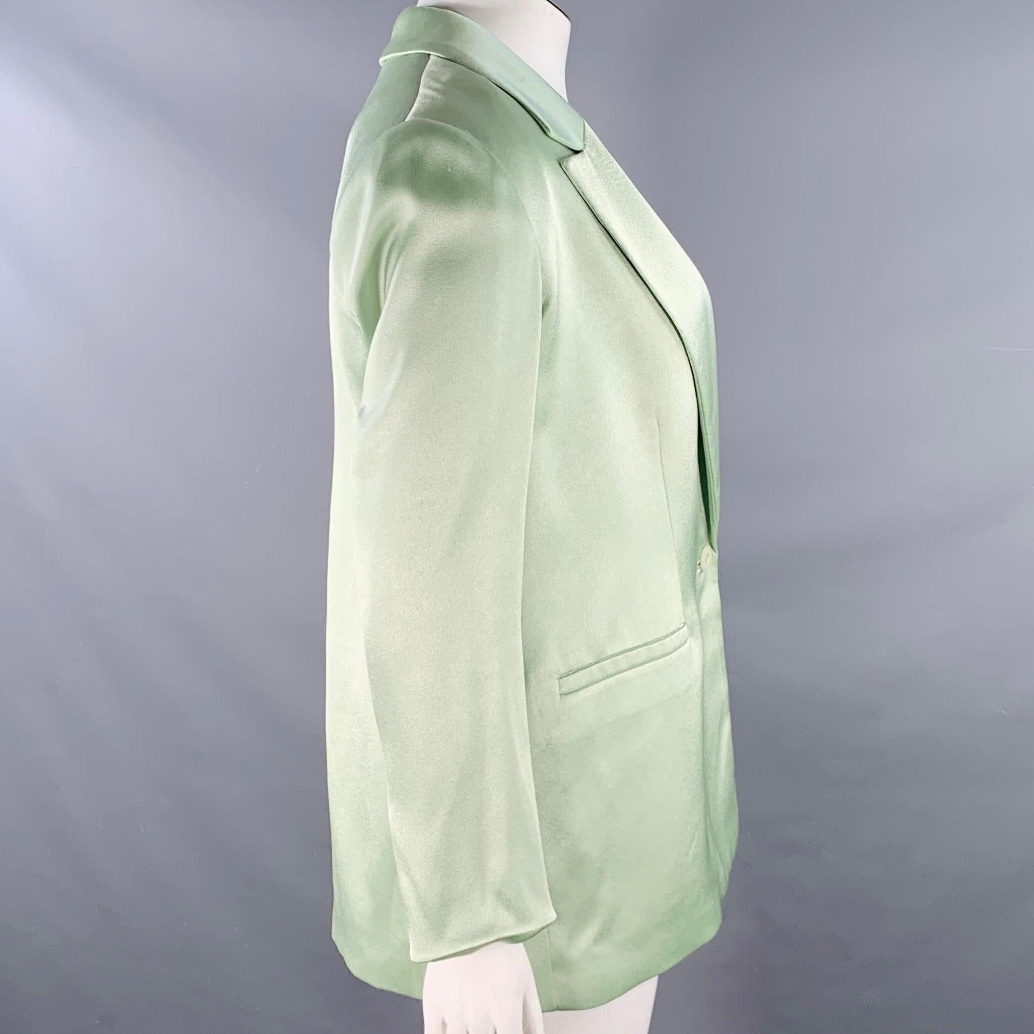 Blazer ALICE + OLIVIA
en tissu mélangé triacétate vert menthe, avec un revers à cran, un dos sans aération et une fermeture à bouton unique.Très bon état d'occasion. Plusieurs petits accrocs. 

Marqué :   12 

Mesures : 
 
Épaule : 17.5 pouces Buste