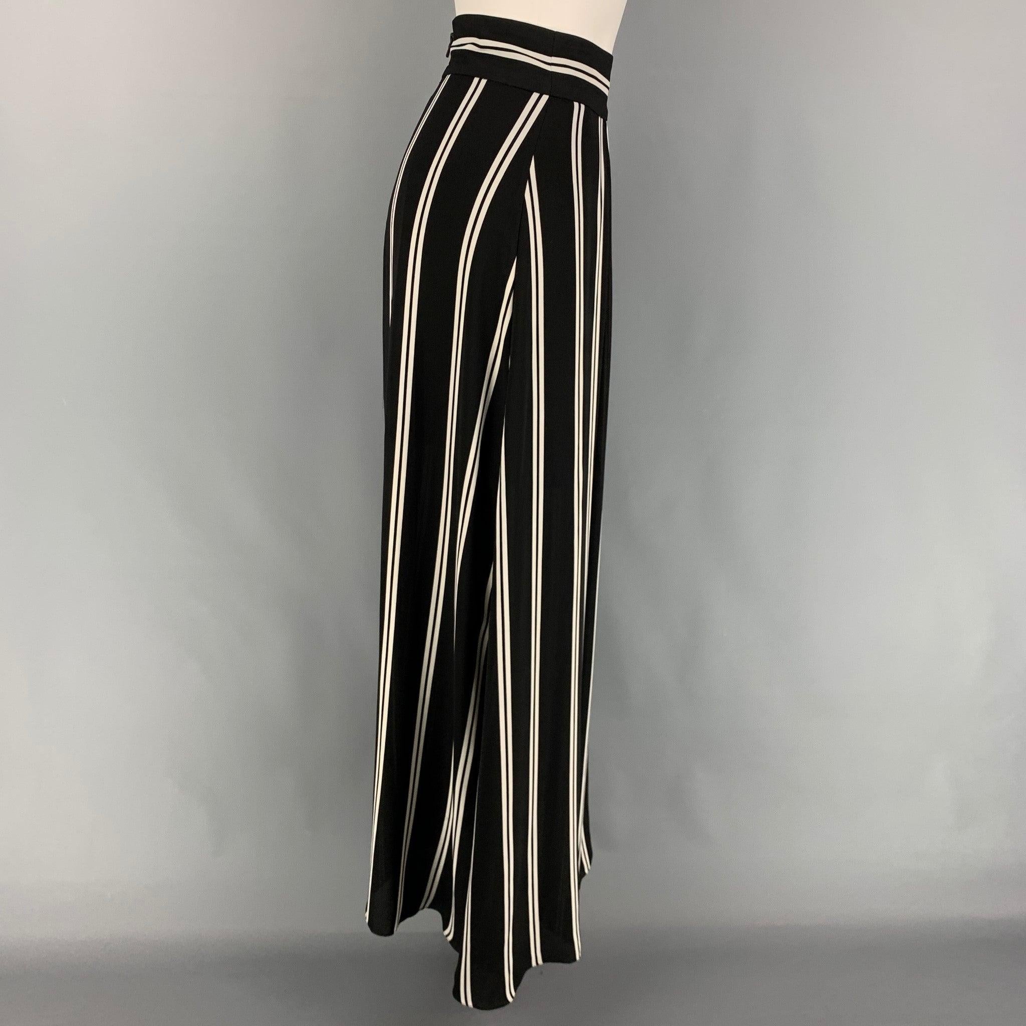 ALICE + OLIVIA skirt comes in a black & white stripe polyester featuring a pleated style and a back zip up closure.
Very Good
Pre-Owned Condition. 

Marked:   2 

Measurements: 
  Waist: 26 inches  Rise: 40 inches  Inseam: 42 inches 
  
  
