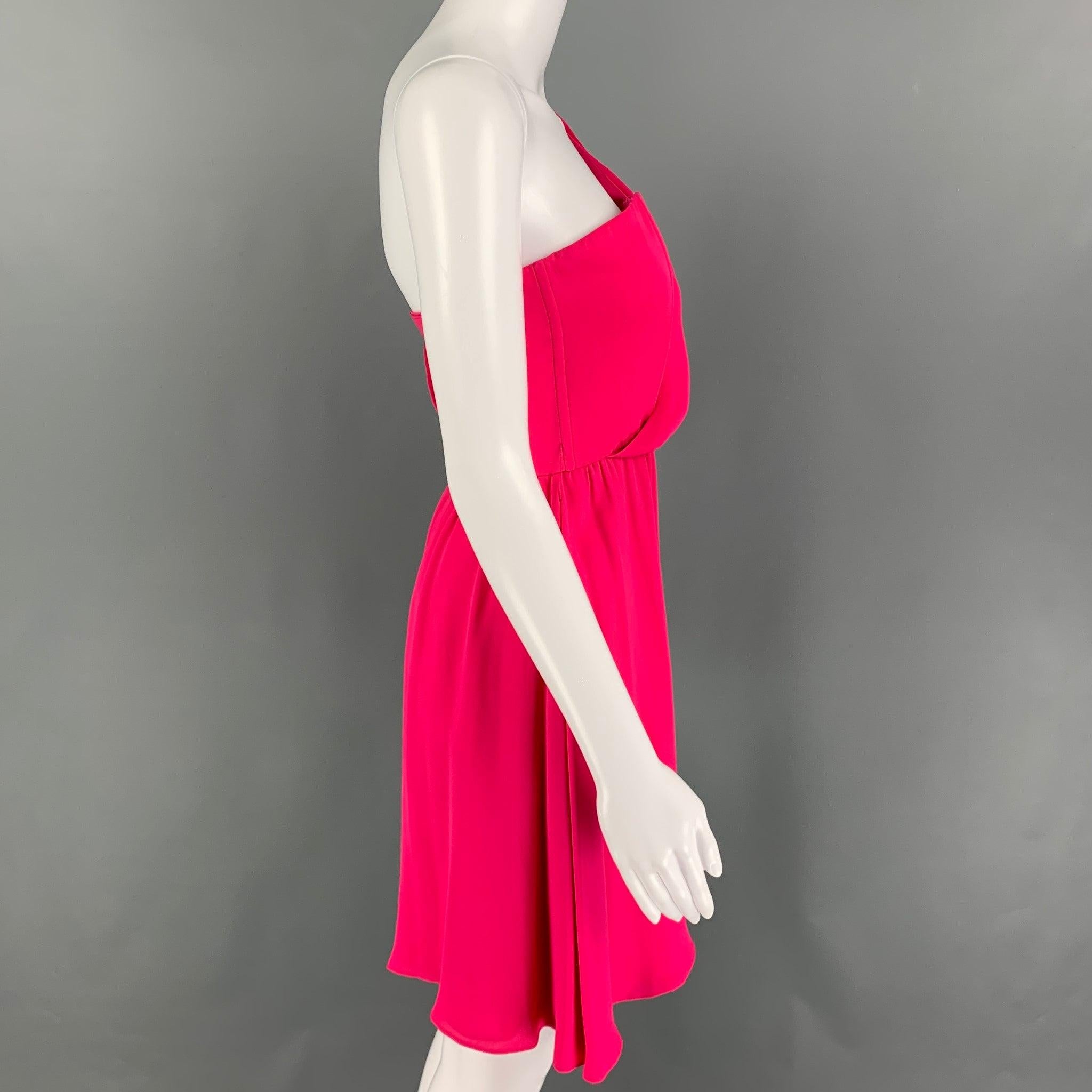 ALICE + OLIVIA mini dress comes in a pink silk fabric featuring an one shoulder style, strapless corset, trumpet sleeve and a back zipper closure.Very Good Pre- Owned Condition. Fabric Tags Removed. 

Marked:   2 

Measurements: 
  Bust: 30 inches