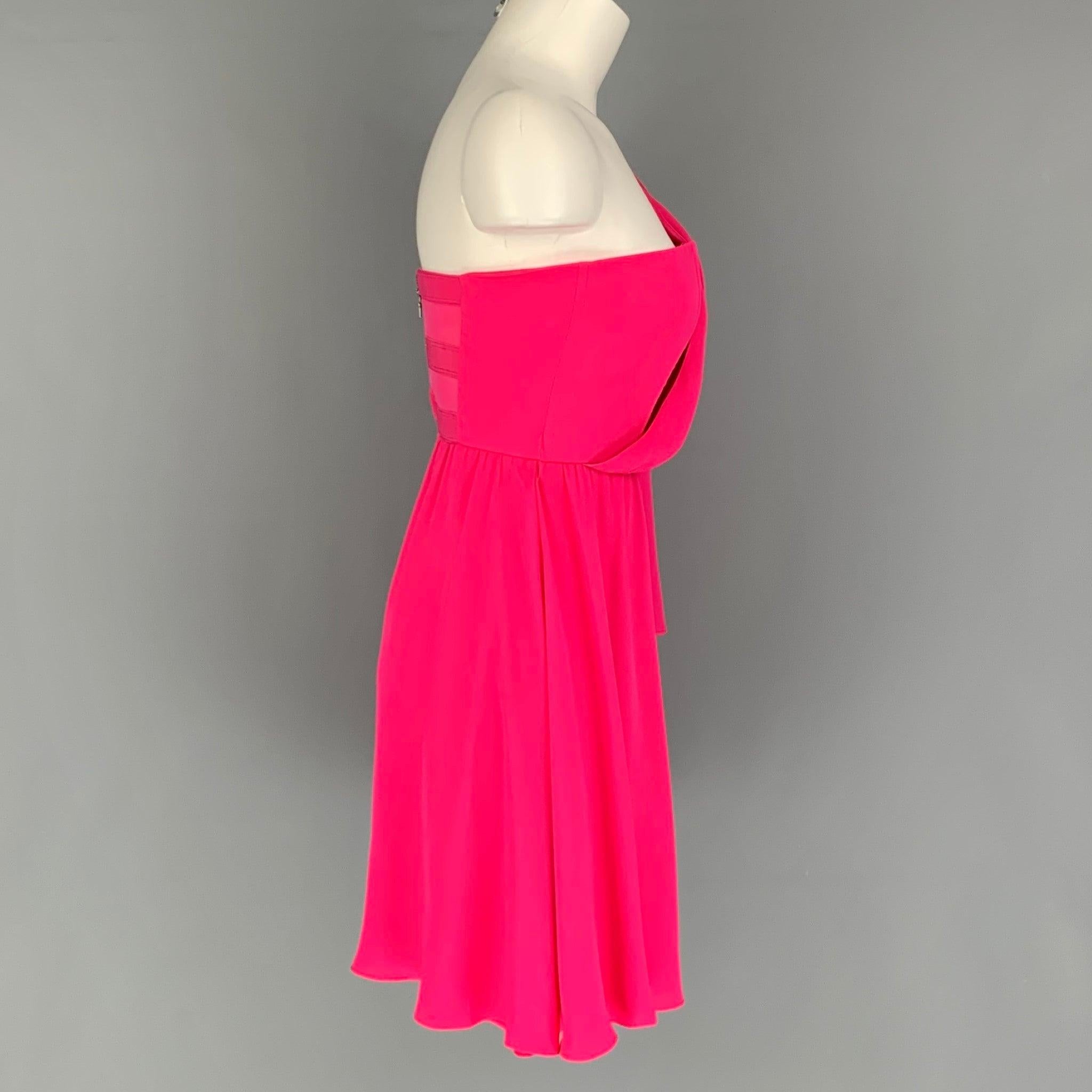 ALICE + OLIVIA mini dress comes in a pink silk fabric featuring an one shoulder style, strapless corset, trumpet sleeve and a back zipper closure.Very Good Pre- Owned Condition. Fabric Tags Removed. 
 

 Marked:  2 
 

 Measurements: 
  Bust: 30