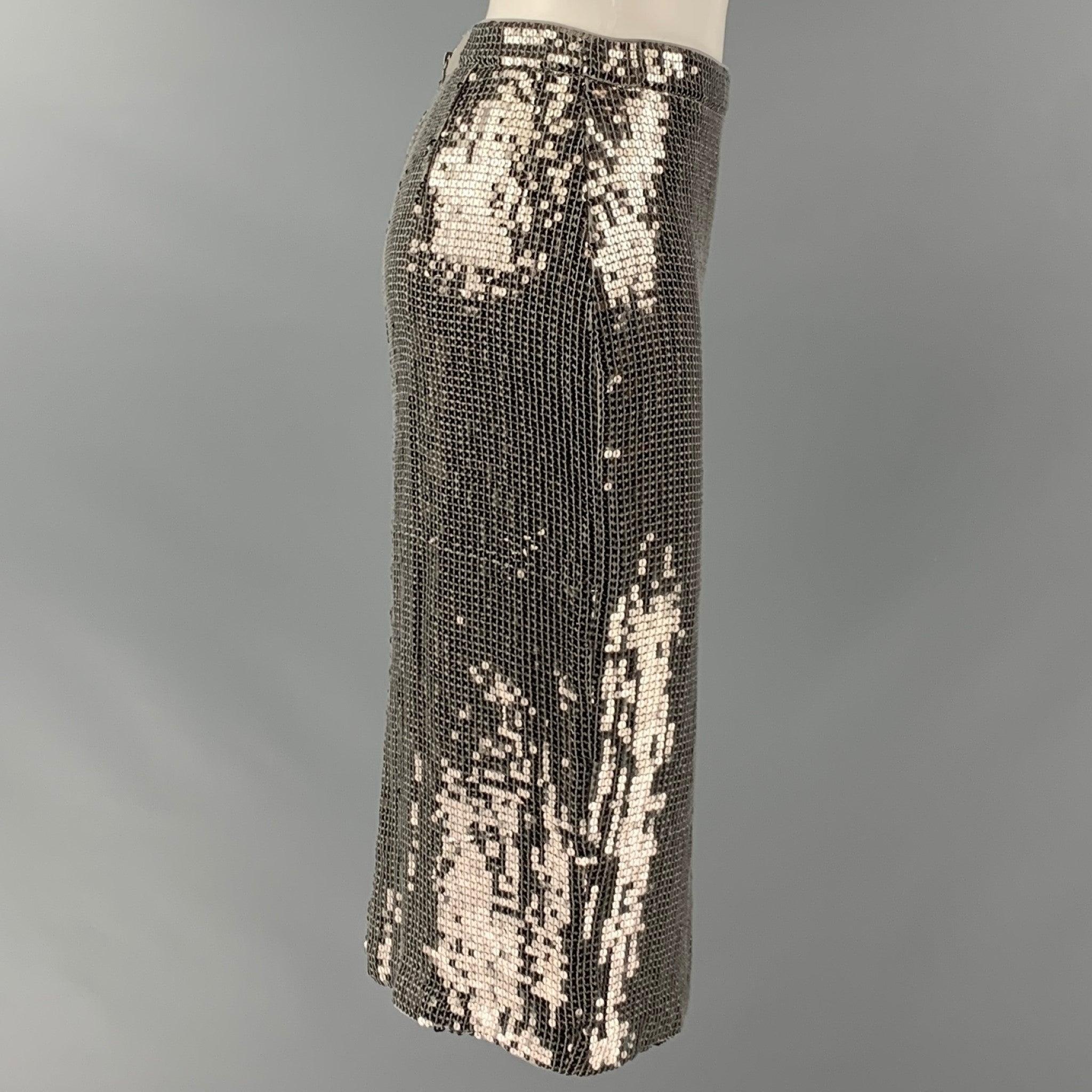 ALICE + OLIVIA skirt comes in a silver sequined viscose woven featuring a pencil style, and a side zipper closure.New with Tags. 

Marked:   2 

Measurements: 
  Waist: 28 inches Hip: 34 inches Length: 25.5 inches 
  
  
 
Reference: