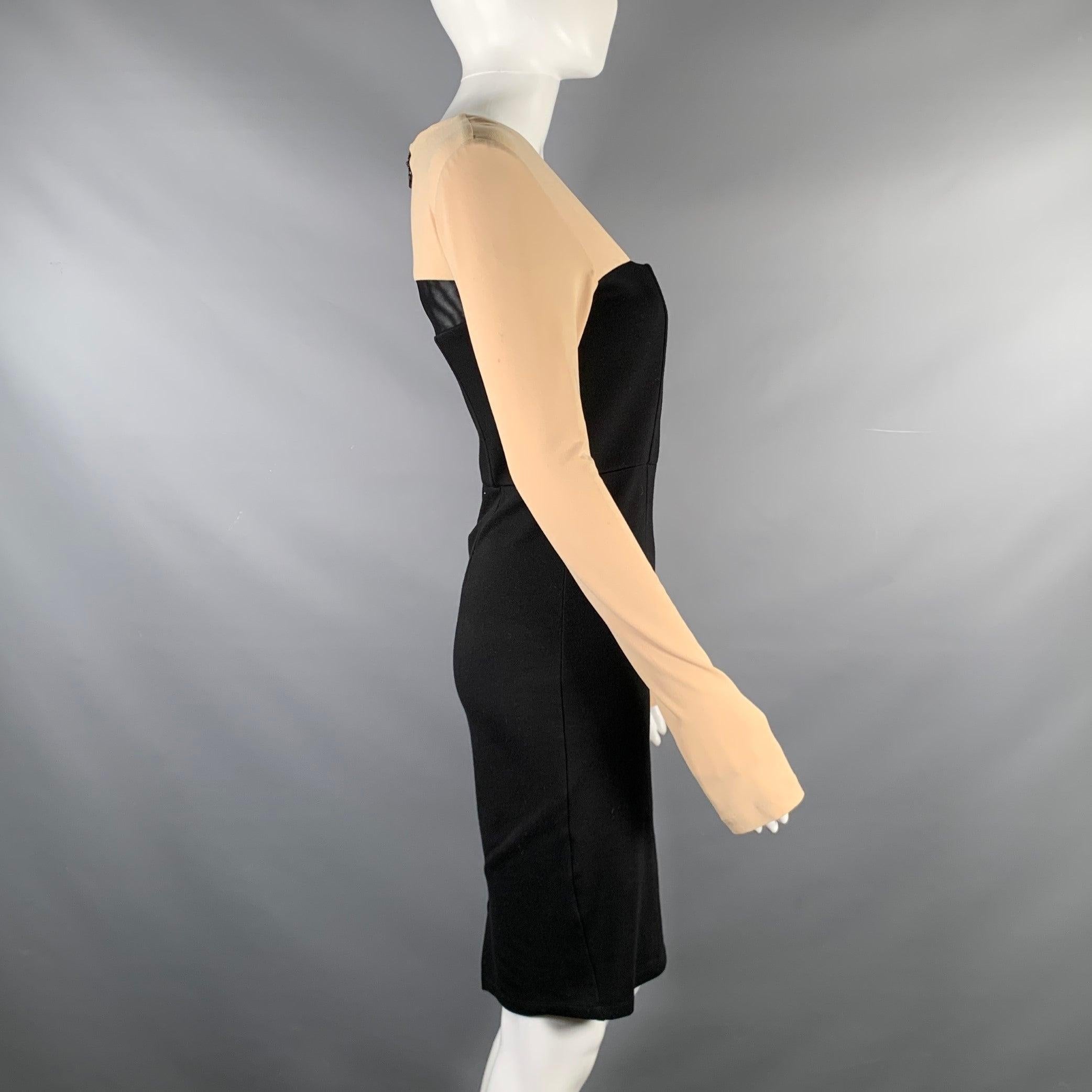 ALICE + OLIVIA Employed long sleeve dress comes in black rayon jersey knit material featuring A-line silhouette, nude long sleeve, square neck line, and half zip up closure at center back.Good Pre- Owned Condition. AS- IS. 

Marked:  
6