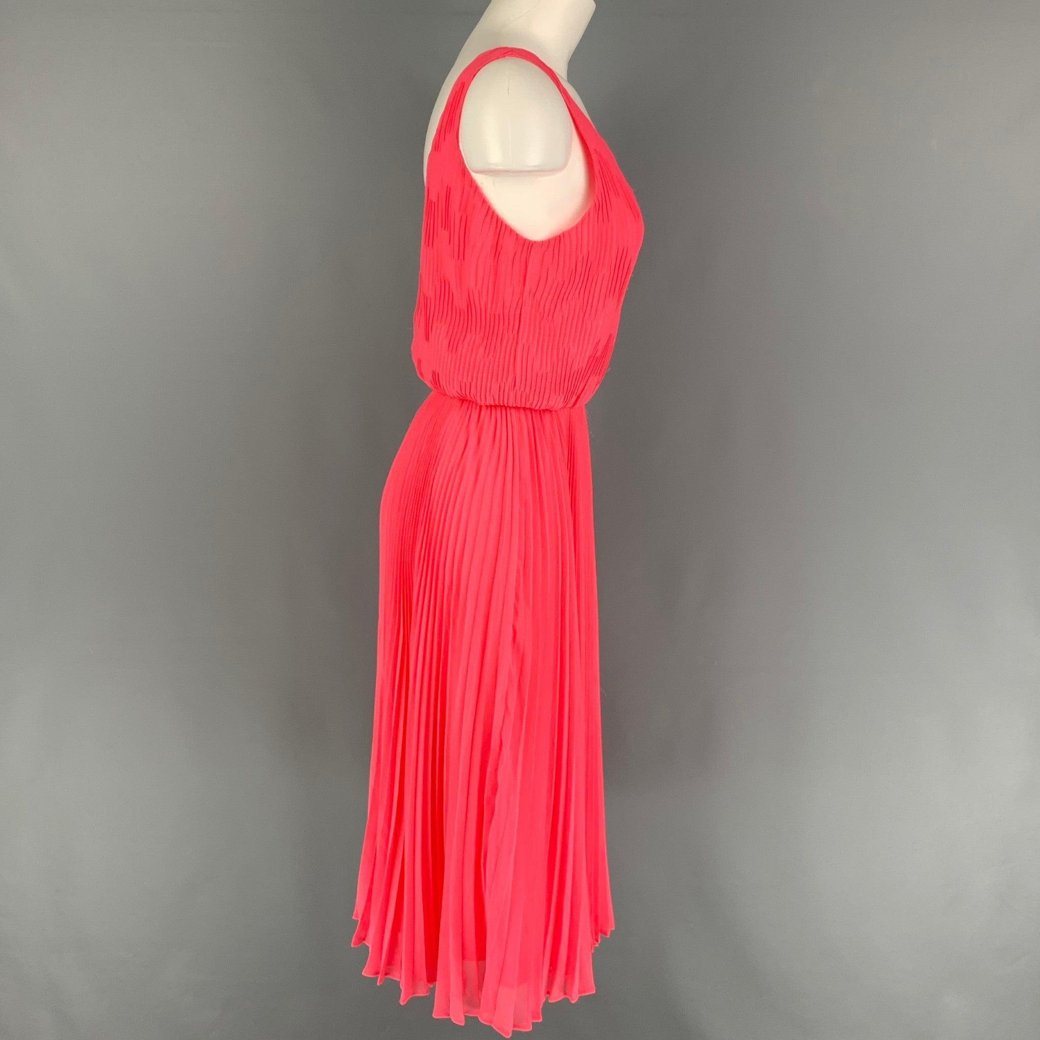ALICE + OLIVIA dress comes in a pink polyester / lurex featuring an a-line style, pleated, sleeveless, elastic waistband. and a back zip up closure.
Very Good
Pre-Owned Condition. 

Marked:   6 

Measurements: 
  Bust: 32 inches  Waist: 24 inches 