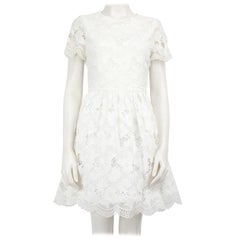 Alice + Olivia - Vestito skater in pizzo floreale bianco taglia M.