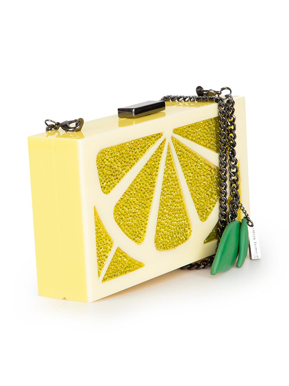 CONDITION is Very good. Minimal wear to bag is evident. Minimal wear to the back and base with light scratches on this used Alice + Olivia designer resale item.
 
 Details
 Cindy Lemon Clutch
 Yellow
 Perspex acrylic
 Mini clutch
 Lemon pattern
