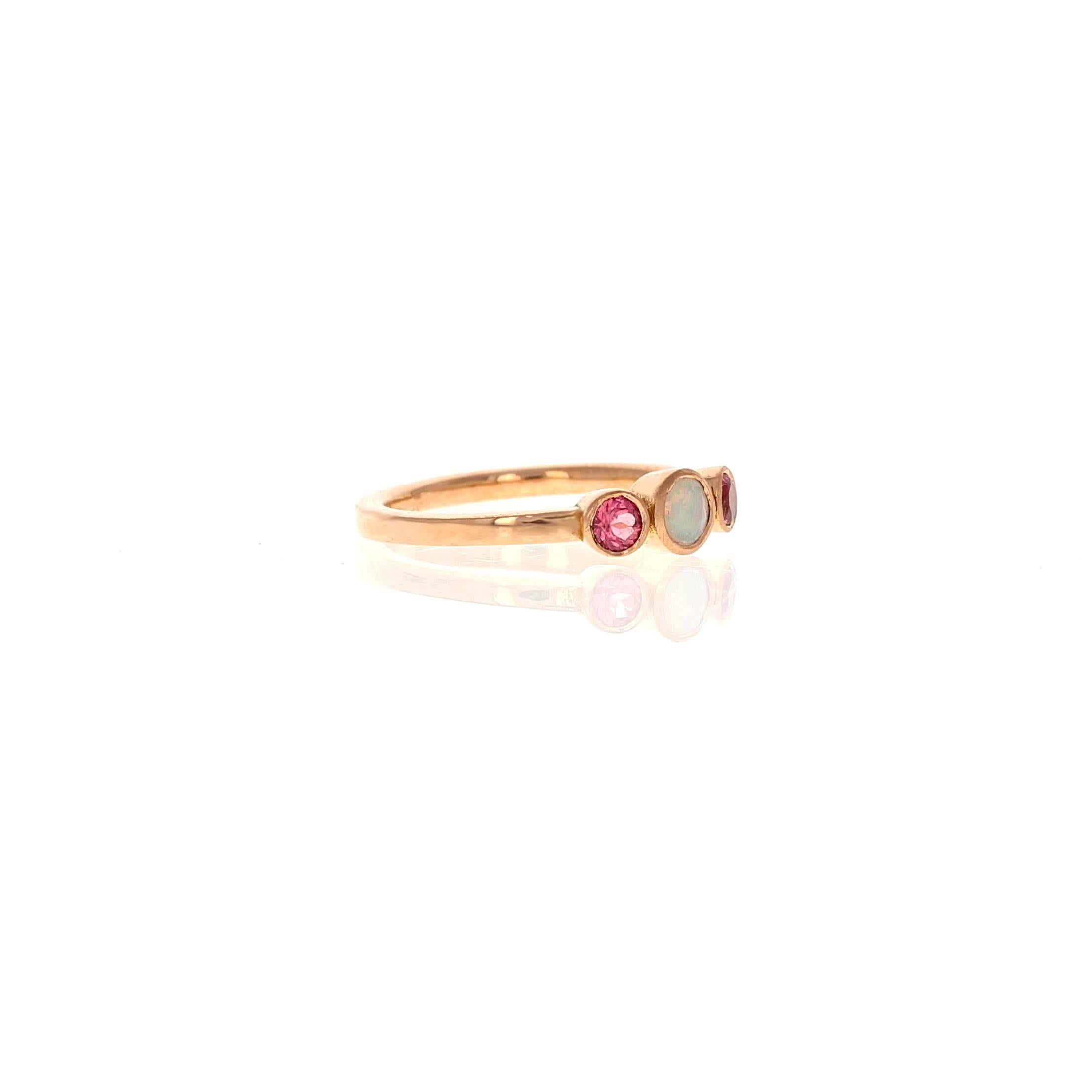 The Alice ring in 18kt Rose Gold with an Ethiopian Opal  & pink Spinel is a three stone ring; the number 3 stands in symbolism of the planet Jupiter which governs good fortune, wealth and success.

• 18kt rose gold
• Ethiopian opal & Vietnam