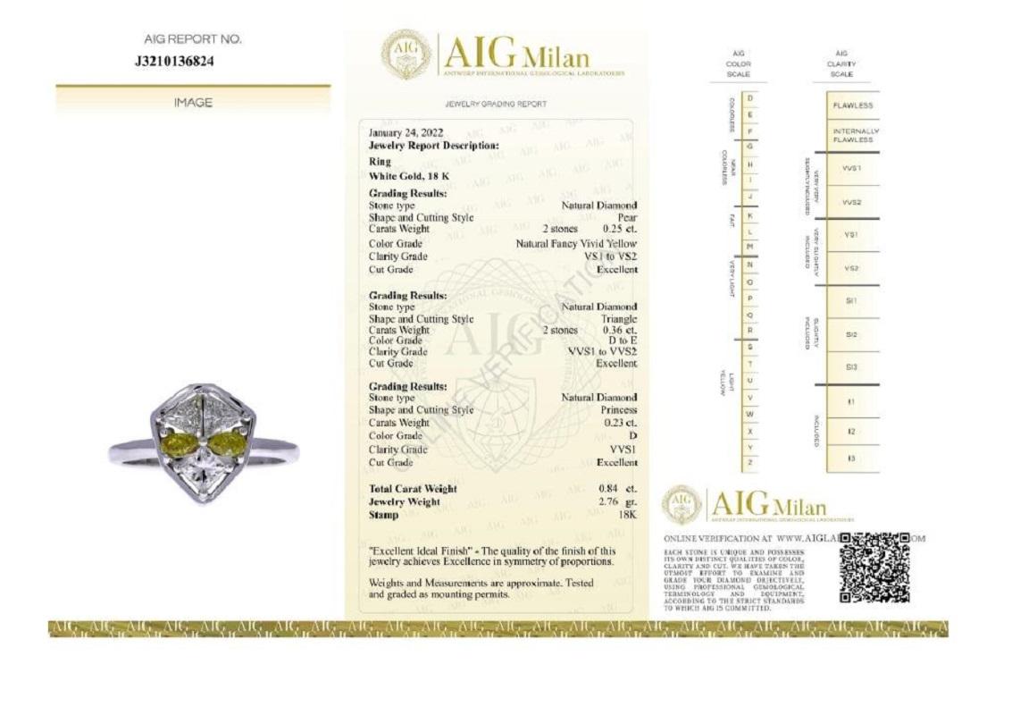 Sweet and shine Alien design diamonds ring mounted with 2 pear shape diamonds with a canary yellow color that creating the eyes of the alien then 2 natural triangles diamonds full of sparkles and then the princess cut diamond that creating the lower