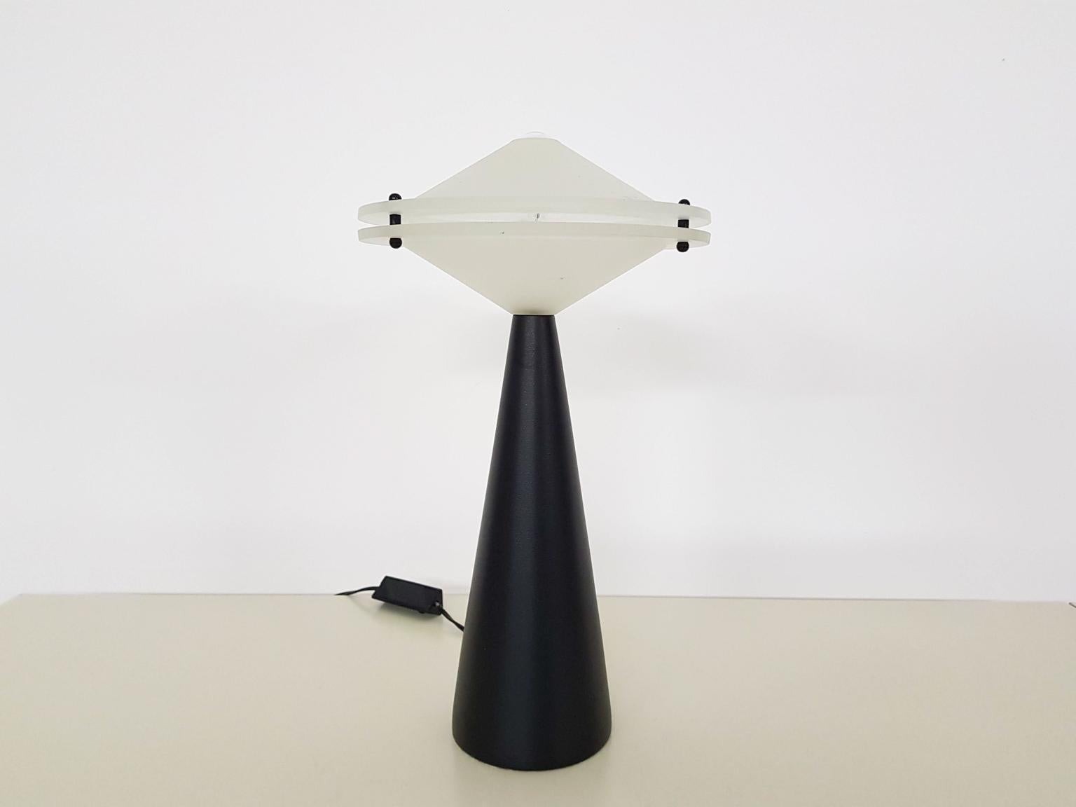 Cesaro L. for Tre CI attributed to Alien dimmable table light, Italy, 1980s

Modernist table lamp made of a heavy metal base and a thick opaline glass shade. It is almost the same as the “Alien” table light designed by Cesaro L. for Tre CI Luce in