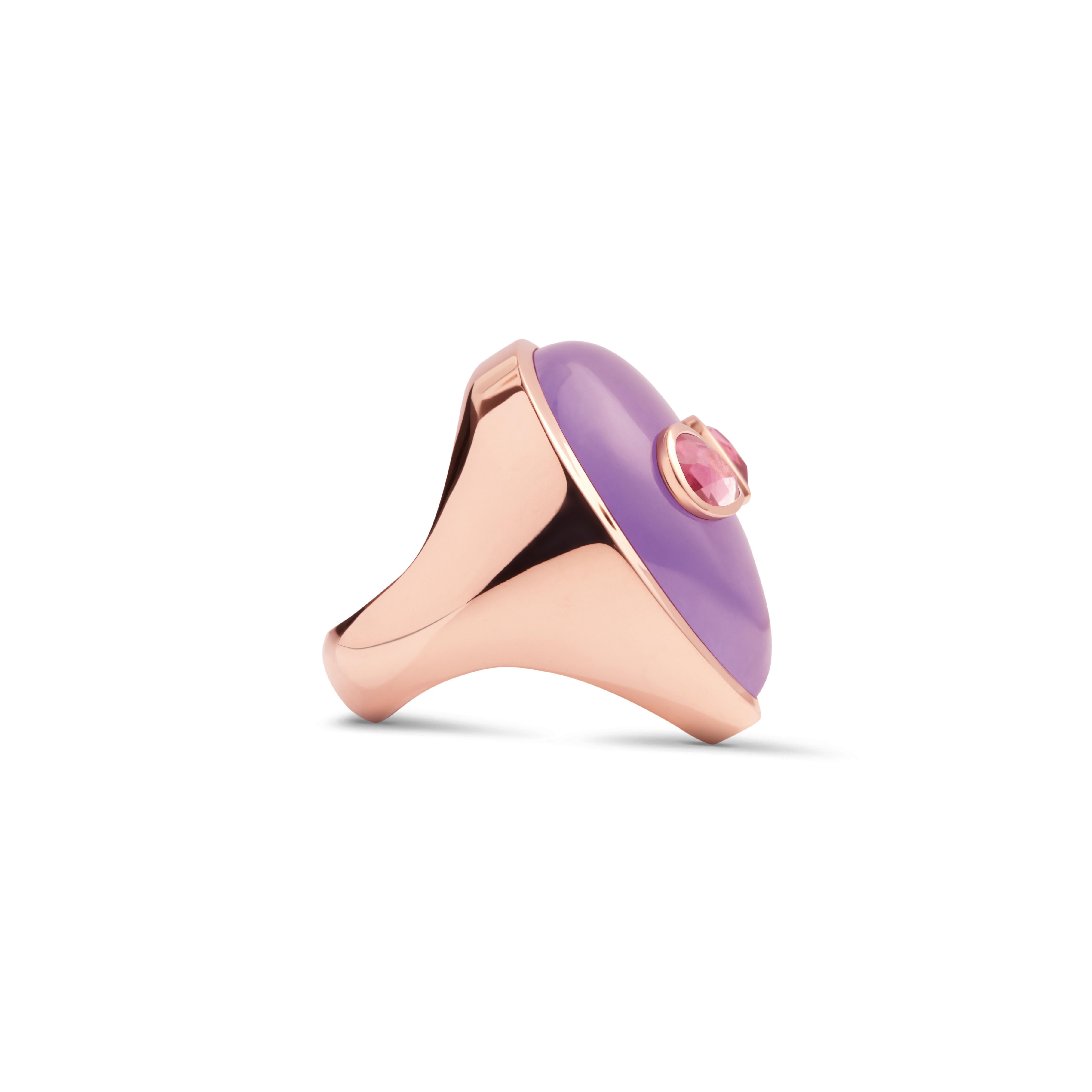 A 90’s obsession with aliens and a minimalist aesthetic are the inspiration behind this one of a kind ring. Bright colored stones imitate the fluorescent colors popular in the 90’s and bring life to this extraterrestrial face made of lavender jade
