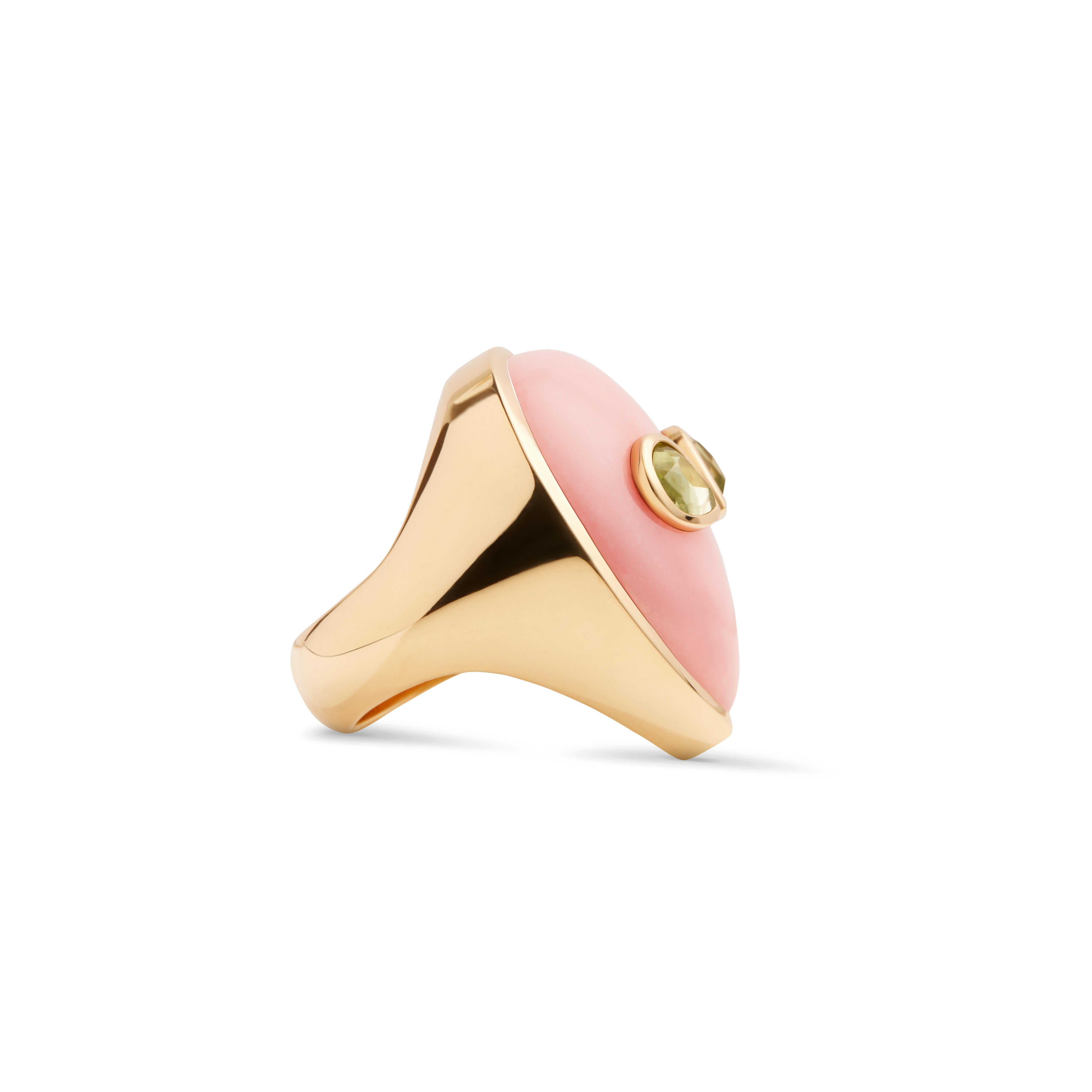 A 90’s obsession with aliens and a minimalist aesthetic are the inspiration behind this one of a kind ring. Bright colored stones imitate the fluorescent colors popular in the 90’s and bring life to this extraterrestrial face made of pink opal and