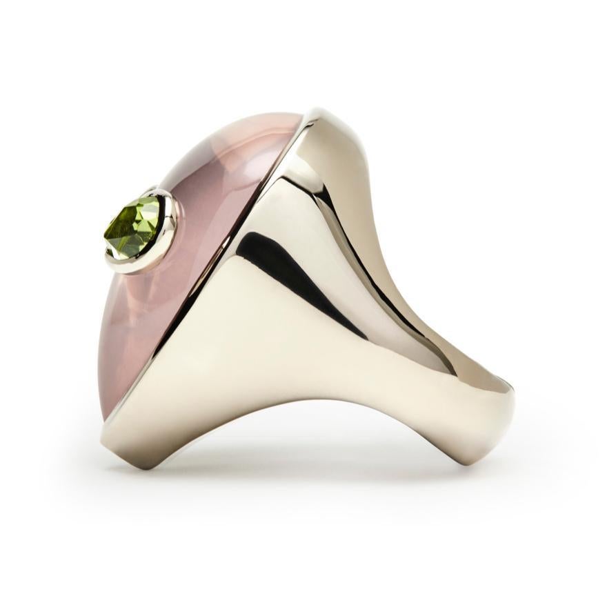 A 90’s obsession with aliens and a minimalist aesthetic are the inspiration behind this limited edition ring. Bright colored stones imitate the fluorescent colors popular in the 90’s and bring life to this extraterrestrial face made of rose quartz