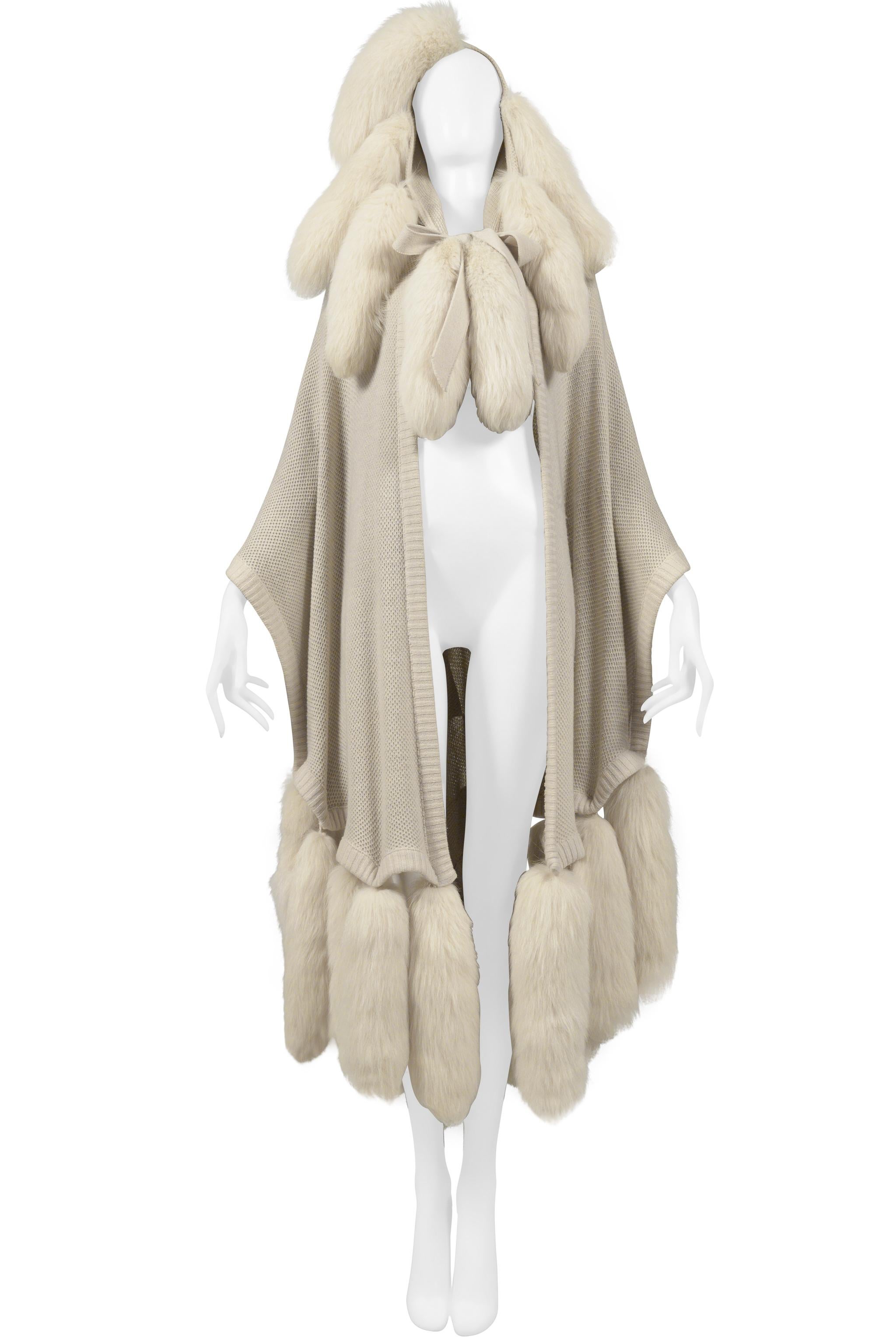 Resurrection Vintage is excited to offer a vintage Alimia Paris off-white fur cape featuring fur tails on hood and bottom of cape, thick drawstrings, and checkered leather patch detailing at back.
* Alimia Paris
* One Size
* No Fabric Label. Feels
