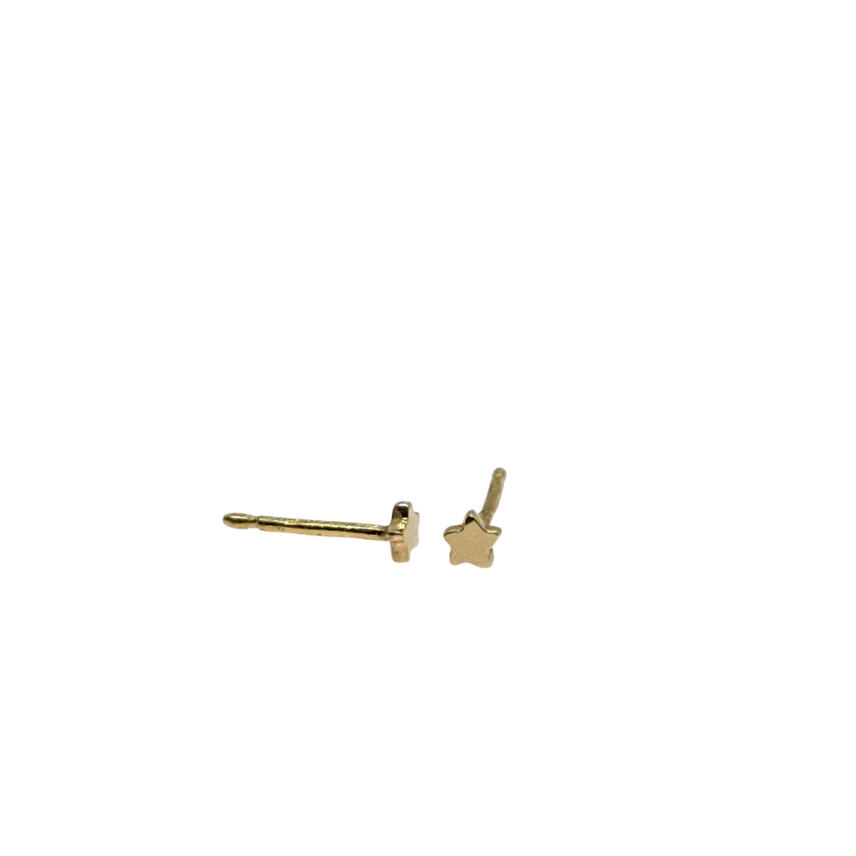 The Star Power Stud earrings are designed to be scattered on the ear. Of course singles or pairs can be worn in the warm tone of pure 18K gold. Mixes perfectly with any other earrings, studs, drops, hoops. In a mini size of 1/8 inch, they are easily