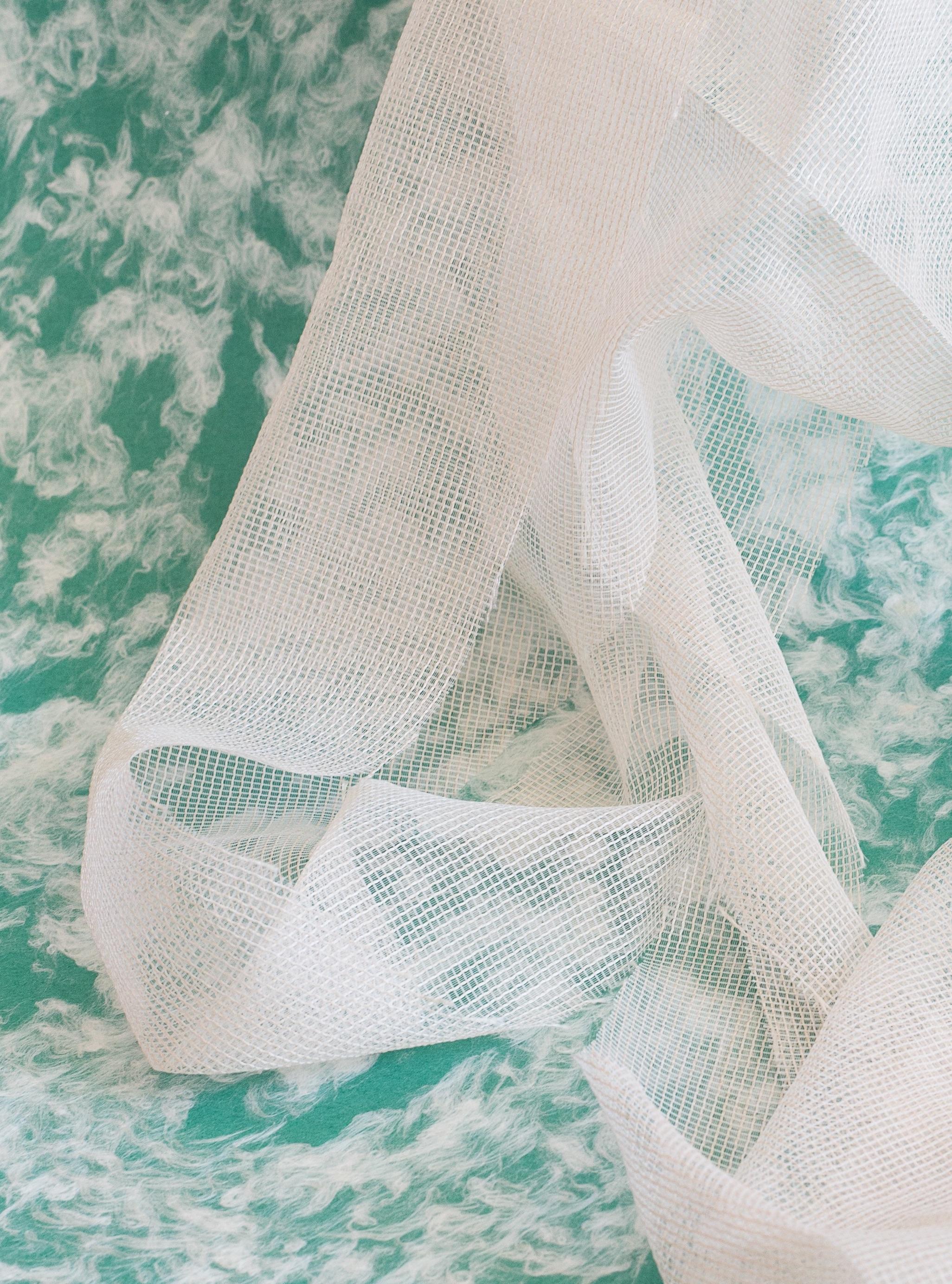 the precise location (of a place) - Turquoise photo, draped white fabric (12x18) - Photograph by Alison Postma