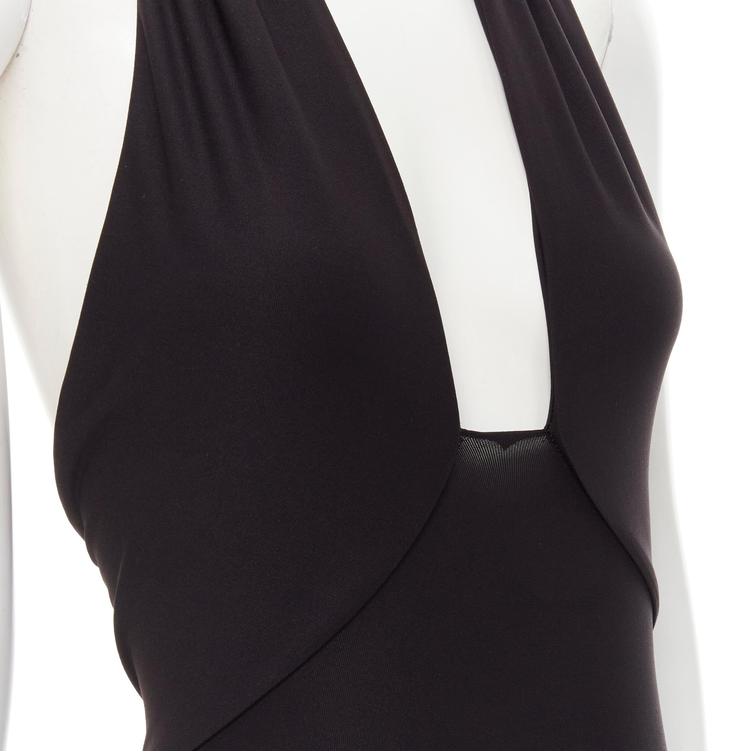 ALIX NYC black plunge neck halter open back body suit top XS 
Reference: LNKO/A01905 
Brand: ALIX NYC 
Material: Elastane 
Color: Black 
Pattern: Solid 
Closure: Hook & Eye 
Extra Detail: Snap button at crotch. 
Estimated Retail Price: US $170 
Made
