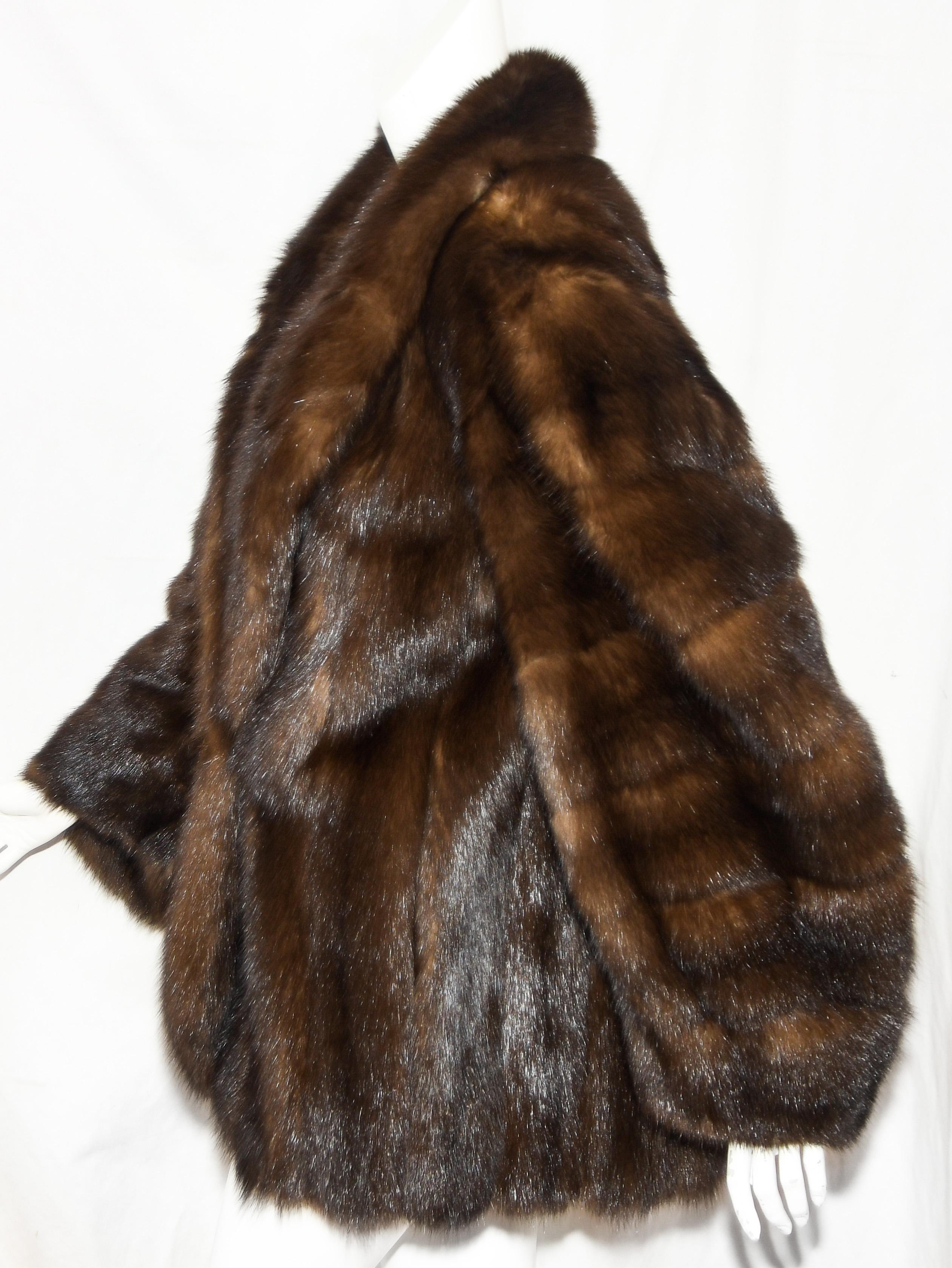 Alixandre mink jacket is fully lined in signature YSL fabric. This coat has been properly stored in cold storage and is in excellent condition. The pelts are soft and buttery and still have beautiful luster. The fit of this coat is oversized  and